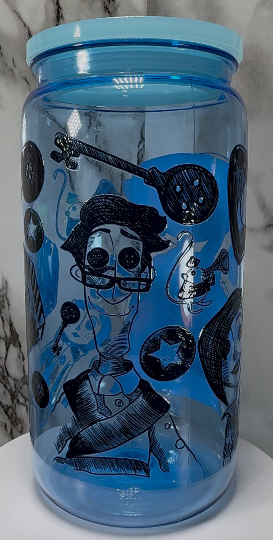 Coraline UVDTF on a blue PLASTIC beer can cup