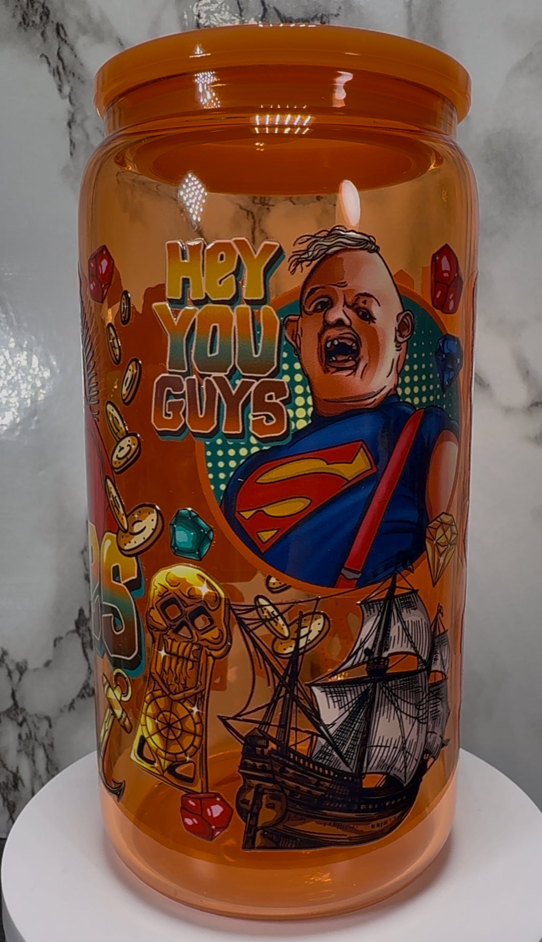 Goonies UVDTF on a orange beer can glass
