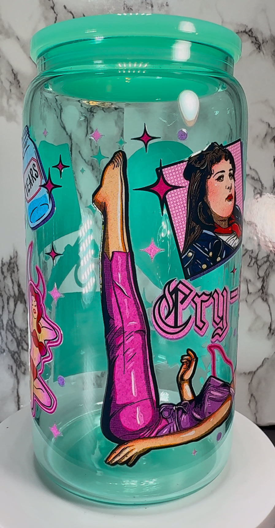 Cry Baby UVDTF on a teal beer can glass