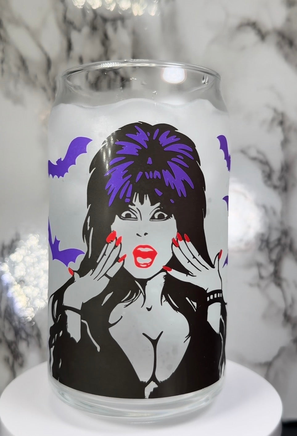 Elvira color changing black, purple and red color changing permanent vinyl on a libbey beer can glass