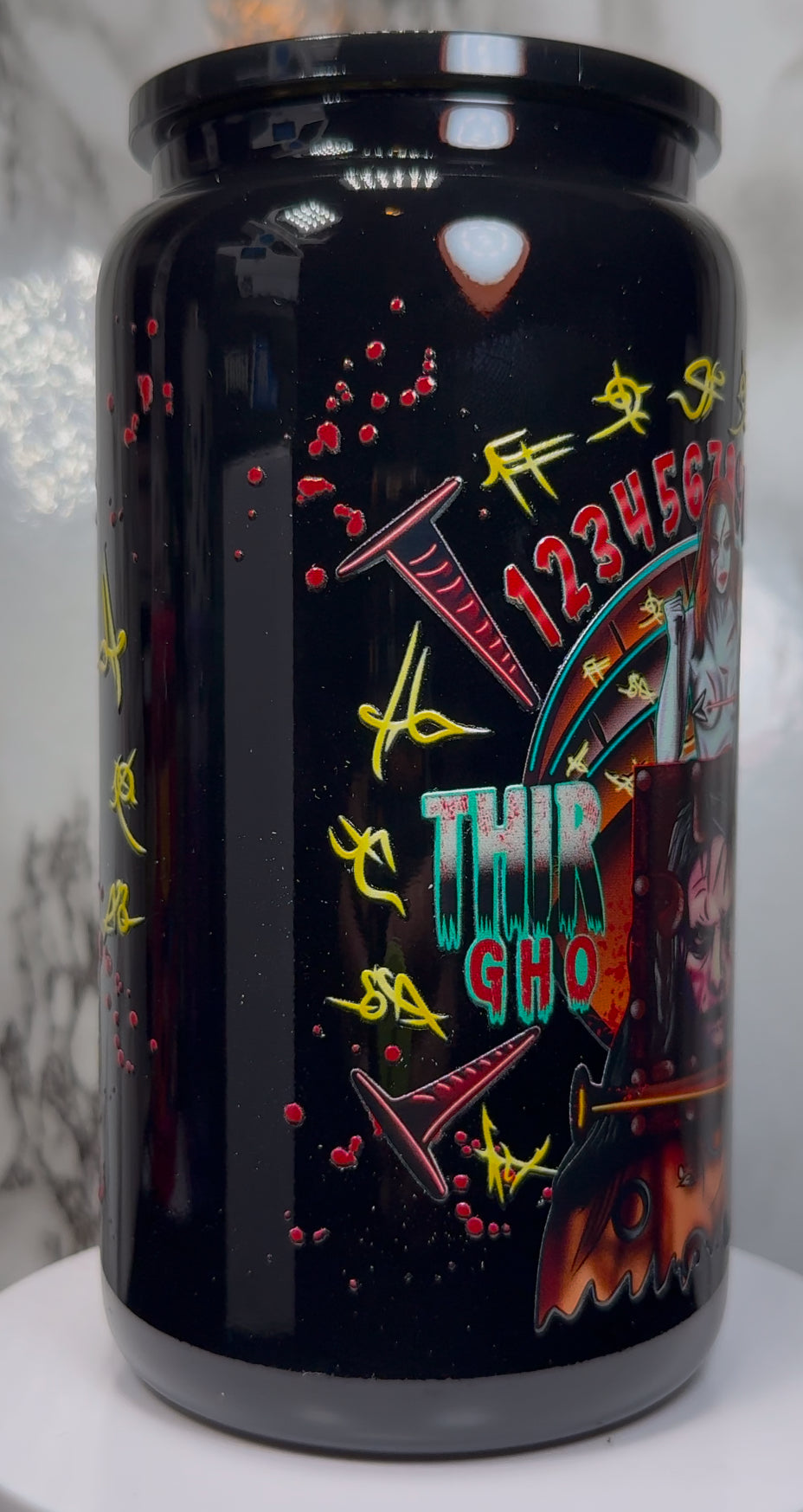 13 Ghosts Angry Princess UVDTF on a black beer can glass
