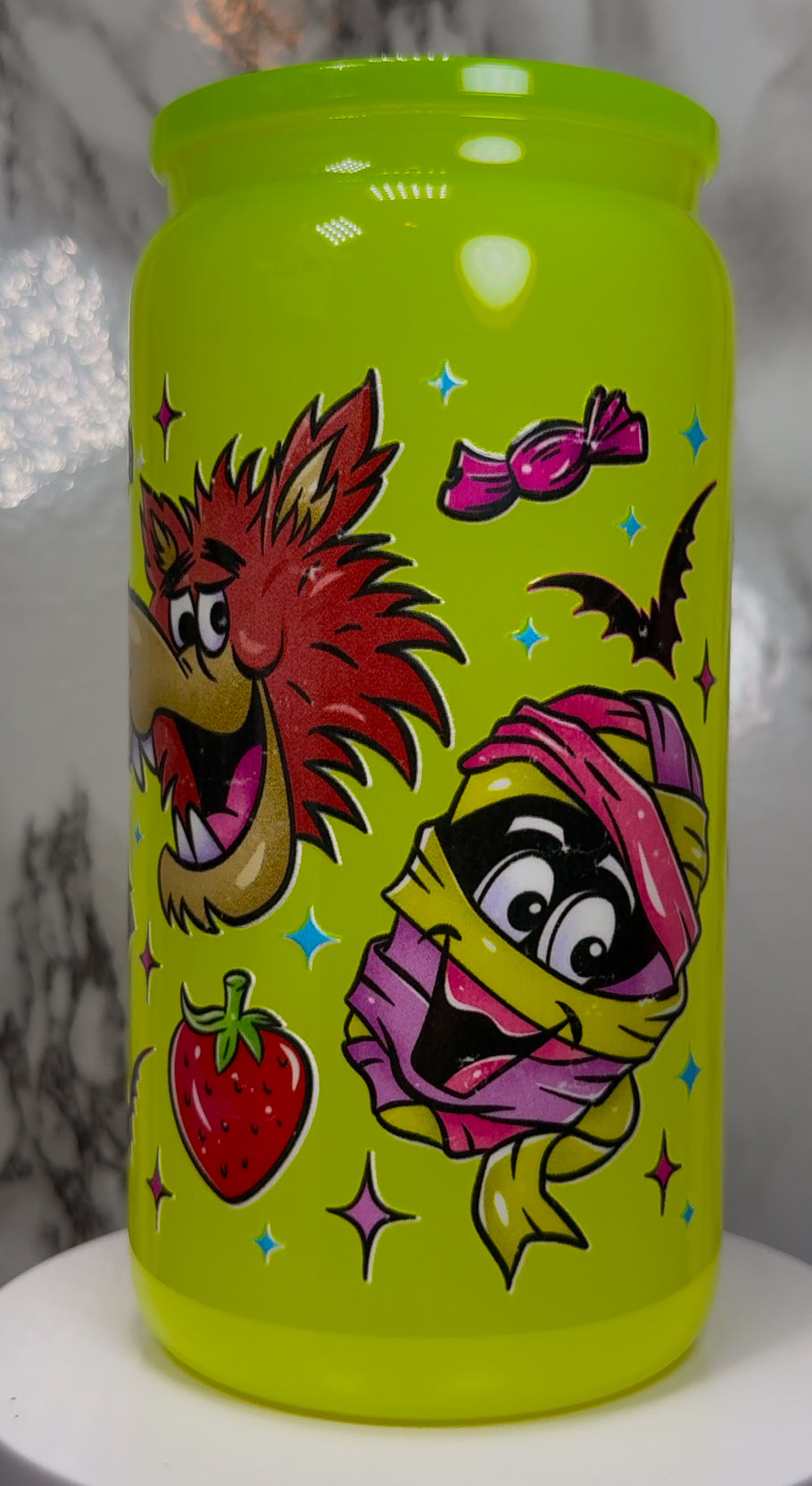 Monster Cereal UVDTF on a bright yellow beer can glass