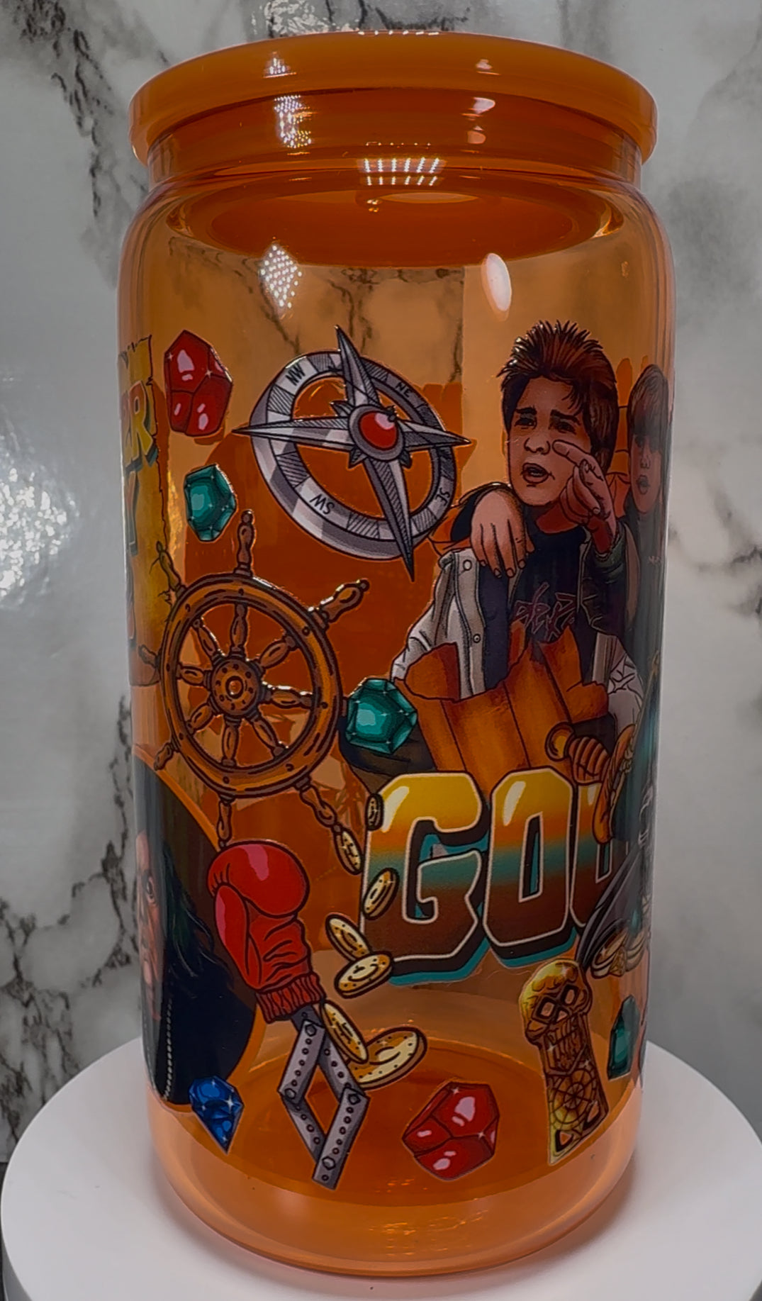 Goonies UVDTF on a orange beer can glass