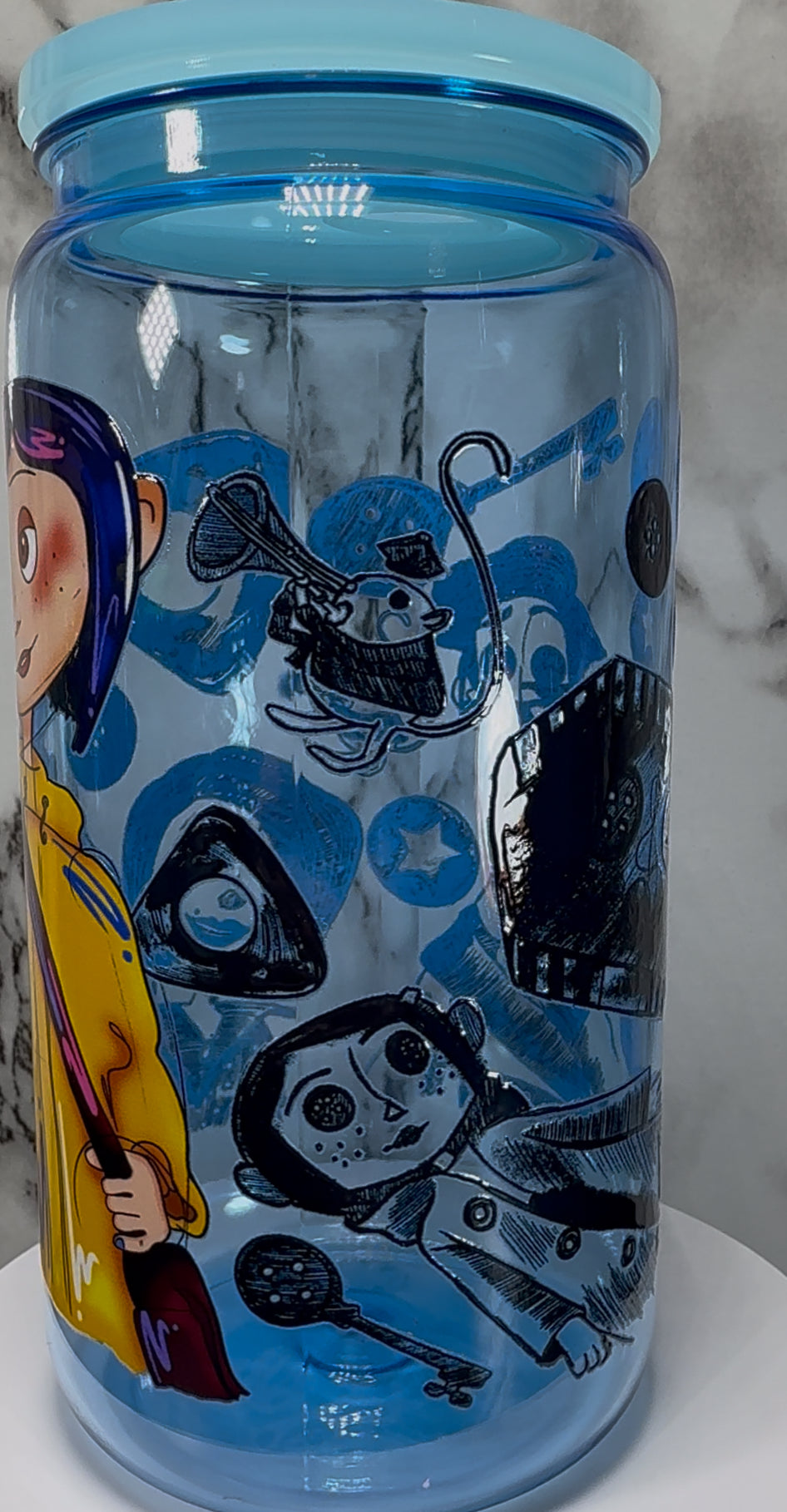 Coraline UVDTF on a blue PLASTIC beer can cup