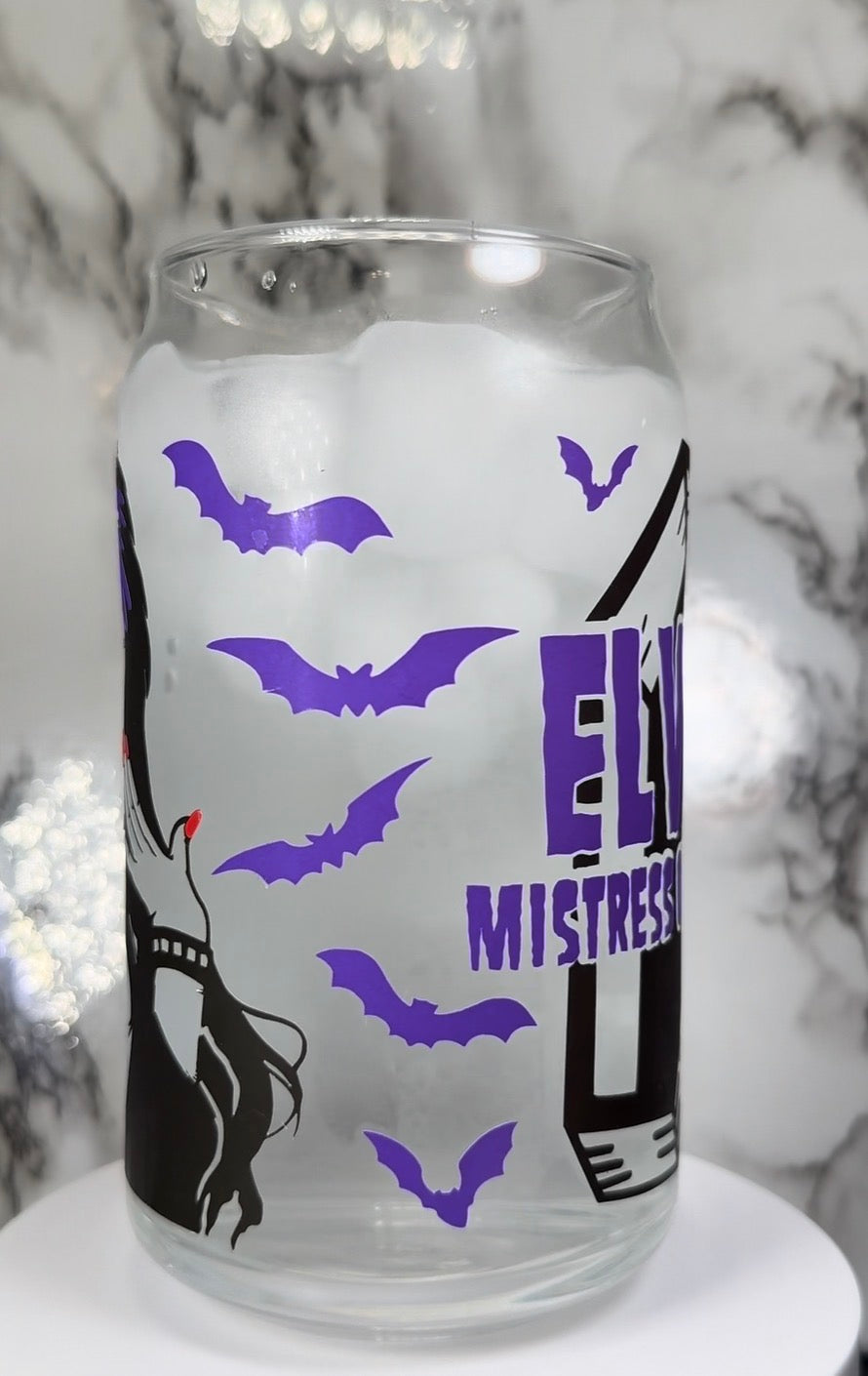 Elvira color changing black, purple and red color changing permanent vinyl on a libbey beer can glass
