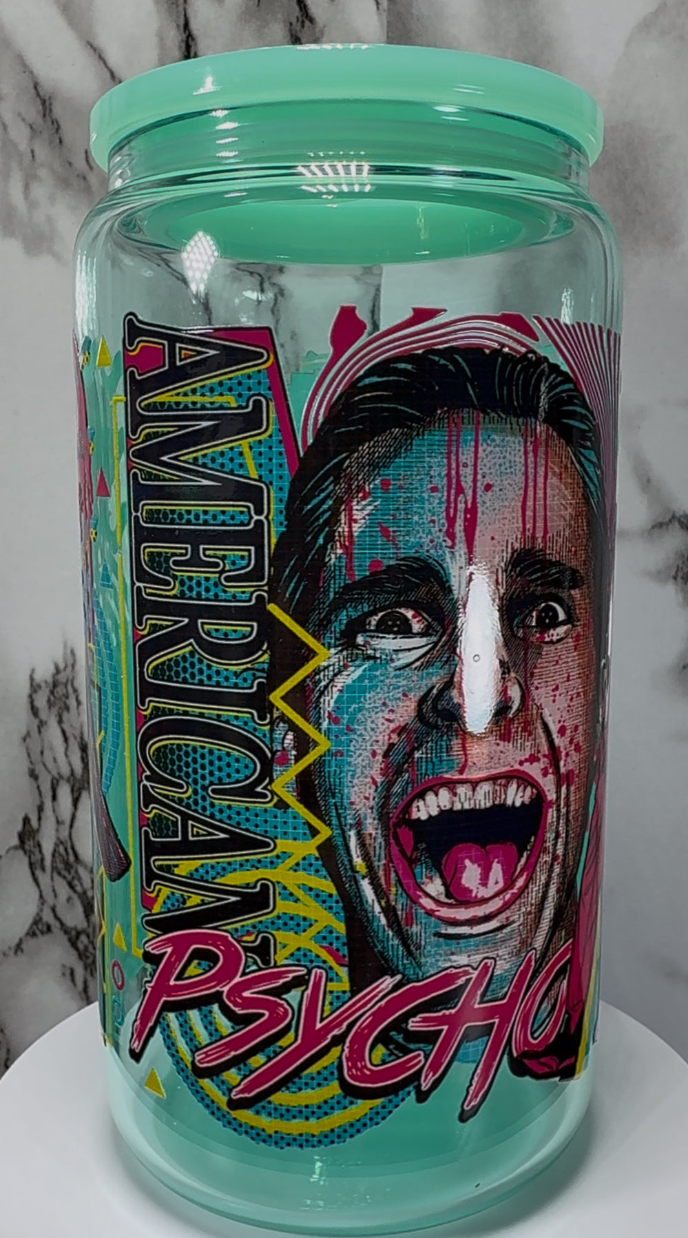 American Psycho Patrick Bateman UVDTF on a teal beer can glass