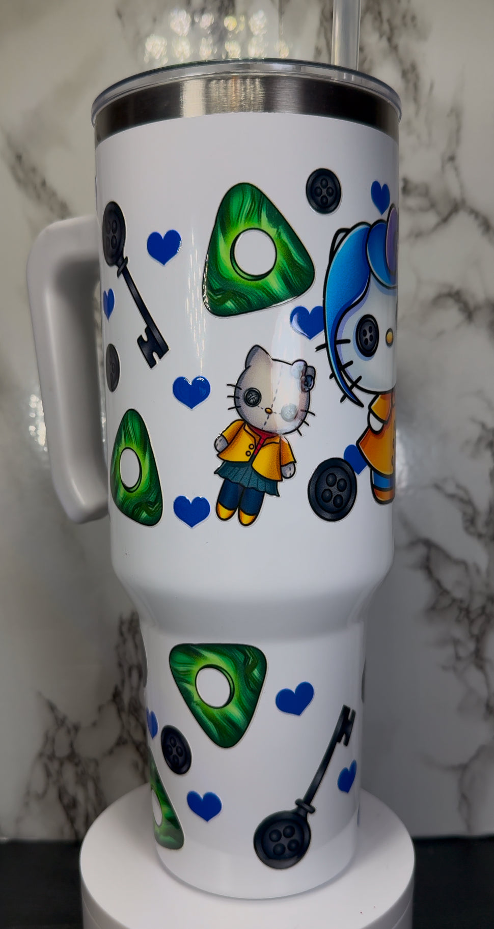 Hello Kitty Coraline UVDTF on a 40 oz white tumbler