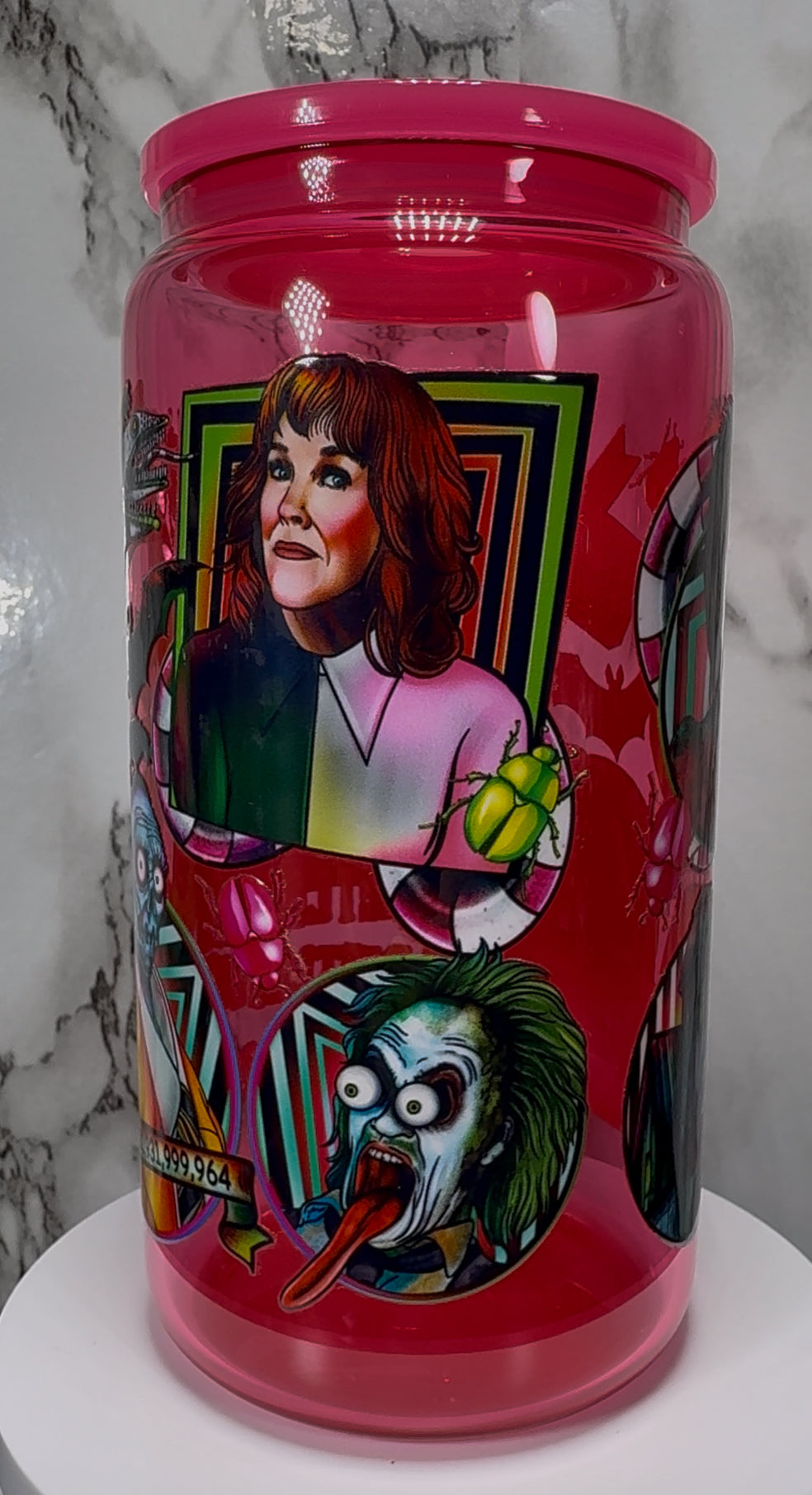 Beetlejuice UVDTF on a hot pink beer can glass