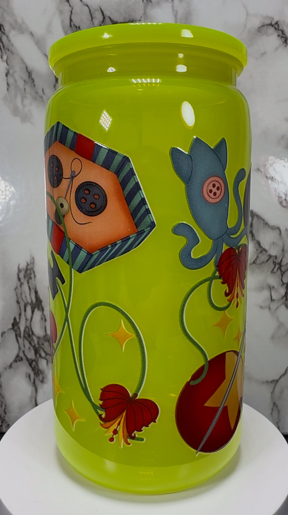 Little Coraline on a bright yellow PLASTIC beer can cup