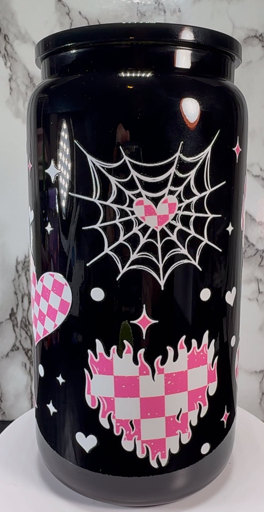 Pink & White checkered hearts UVDTF on a black beer can glass