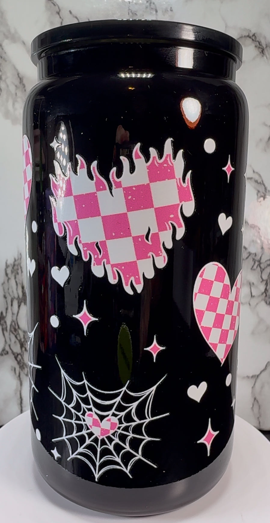 Pink & White checkered hearts UVDTF on a black beer can glass
