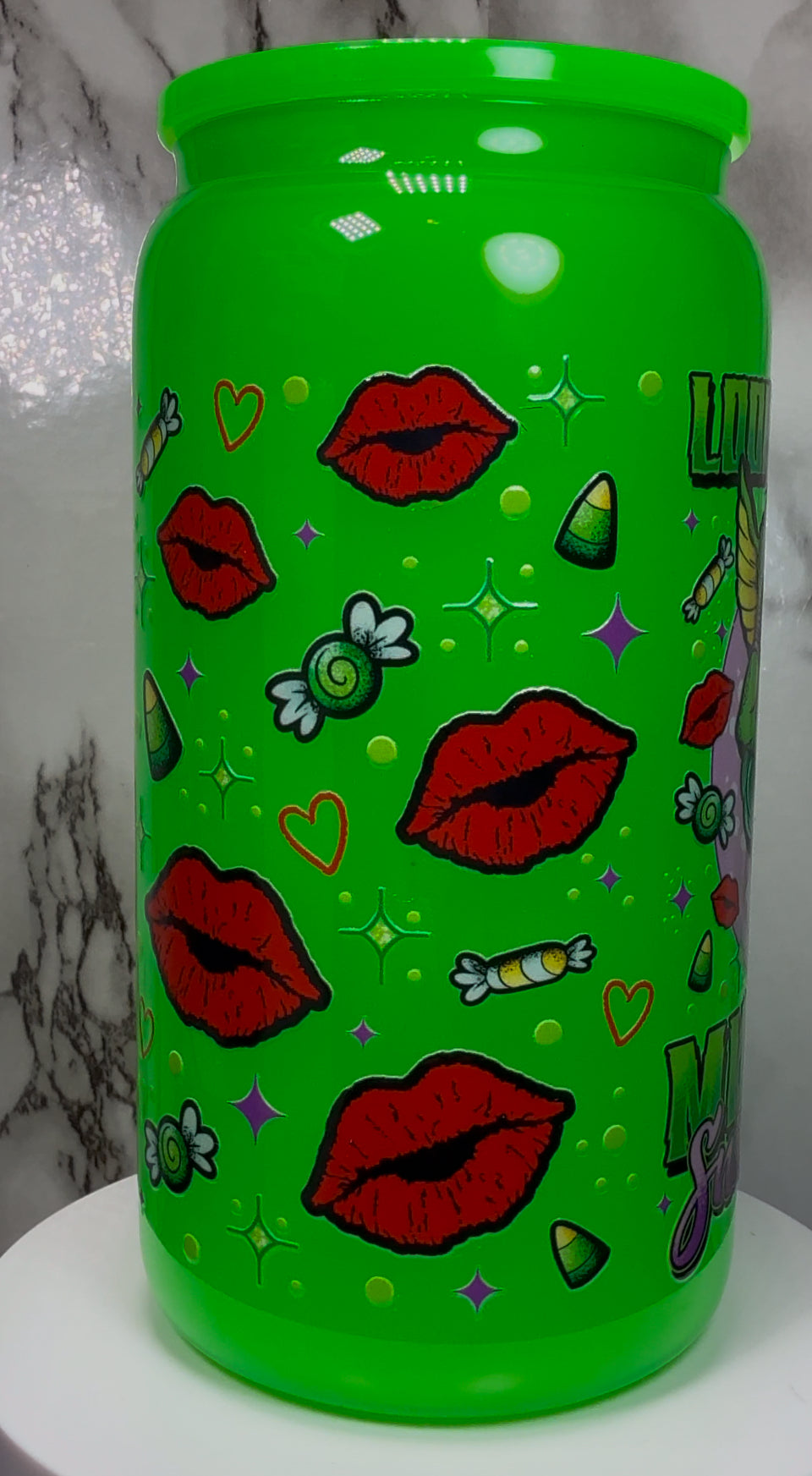 Greta Gremlin UVDTF in a bright green beer can glass