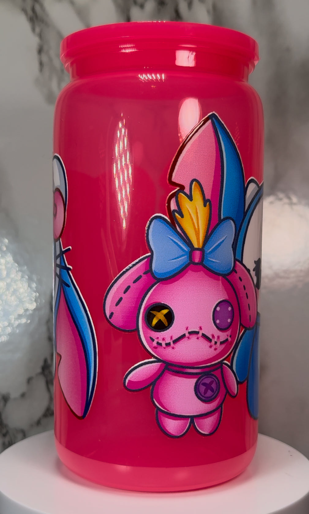 Hello Kitty-Stitch Mash Up UVDTF on a hot pink plastic beer can cup