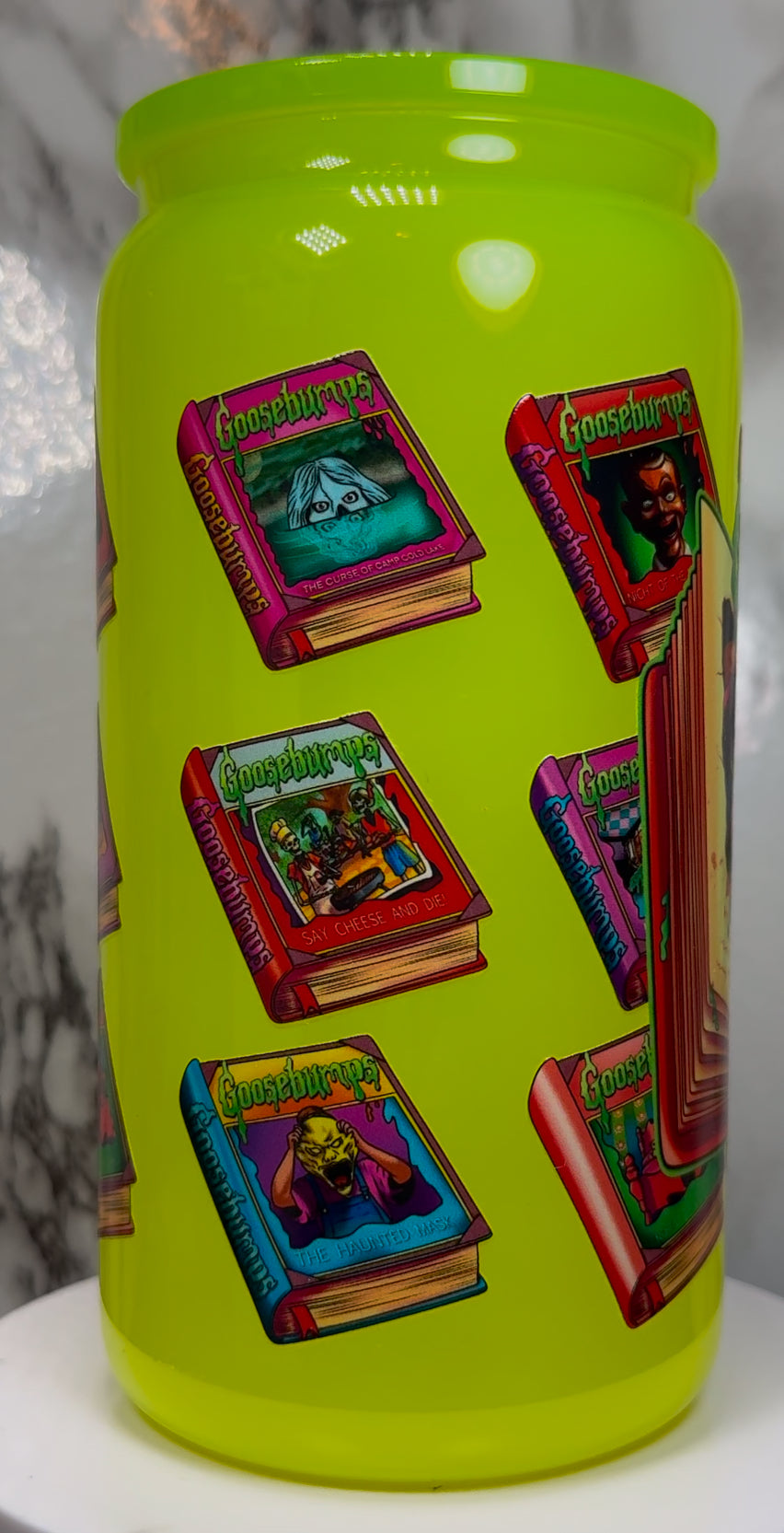 Goosebumps UVDTF on a highlighter yellow beer can glass