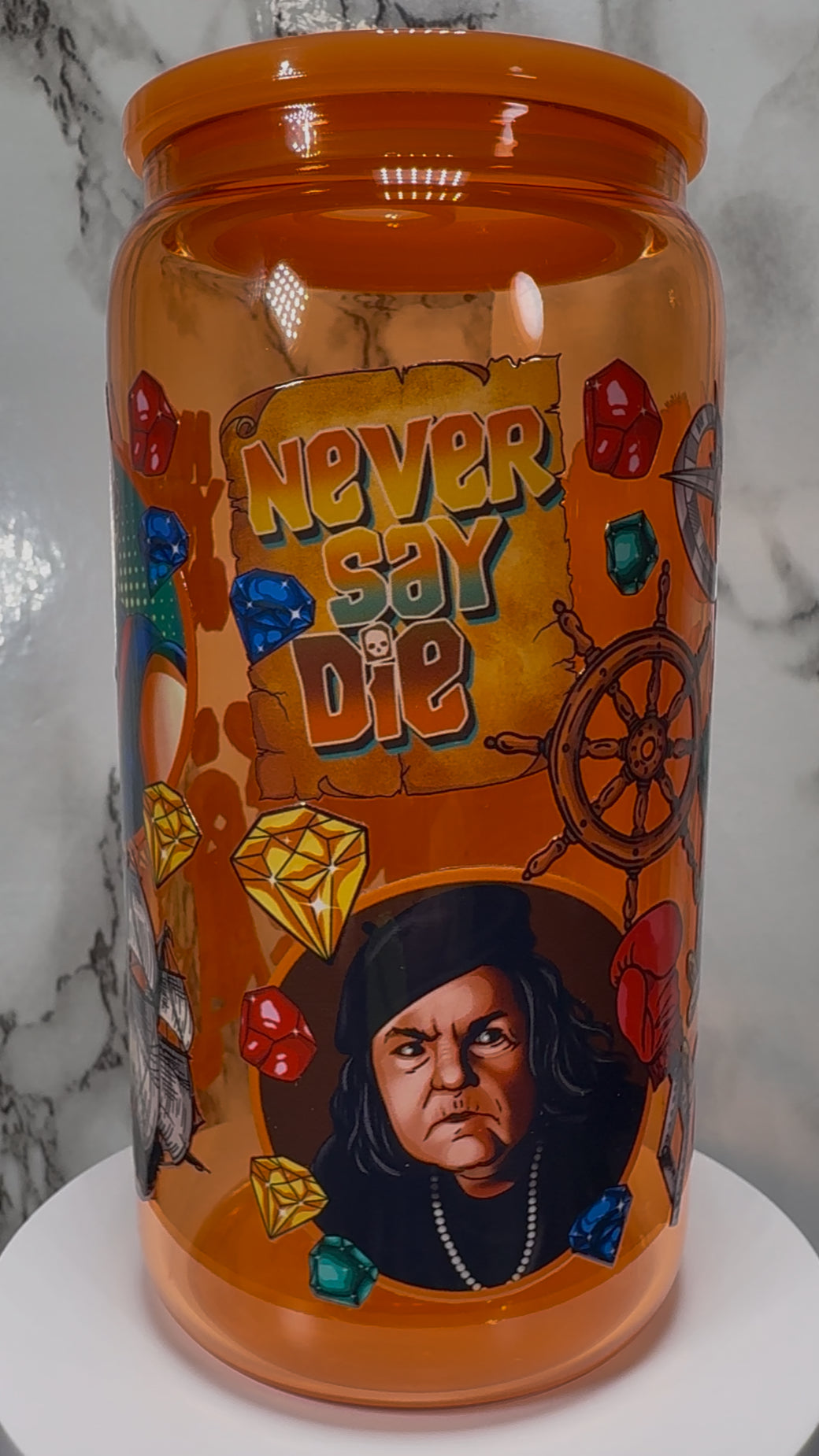 Goonies UVDTF on a orange beer can glass