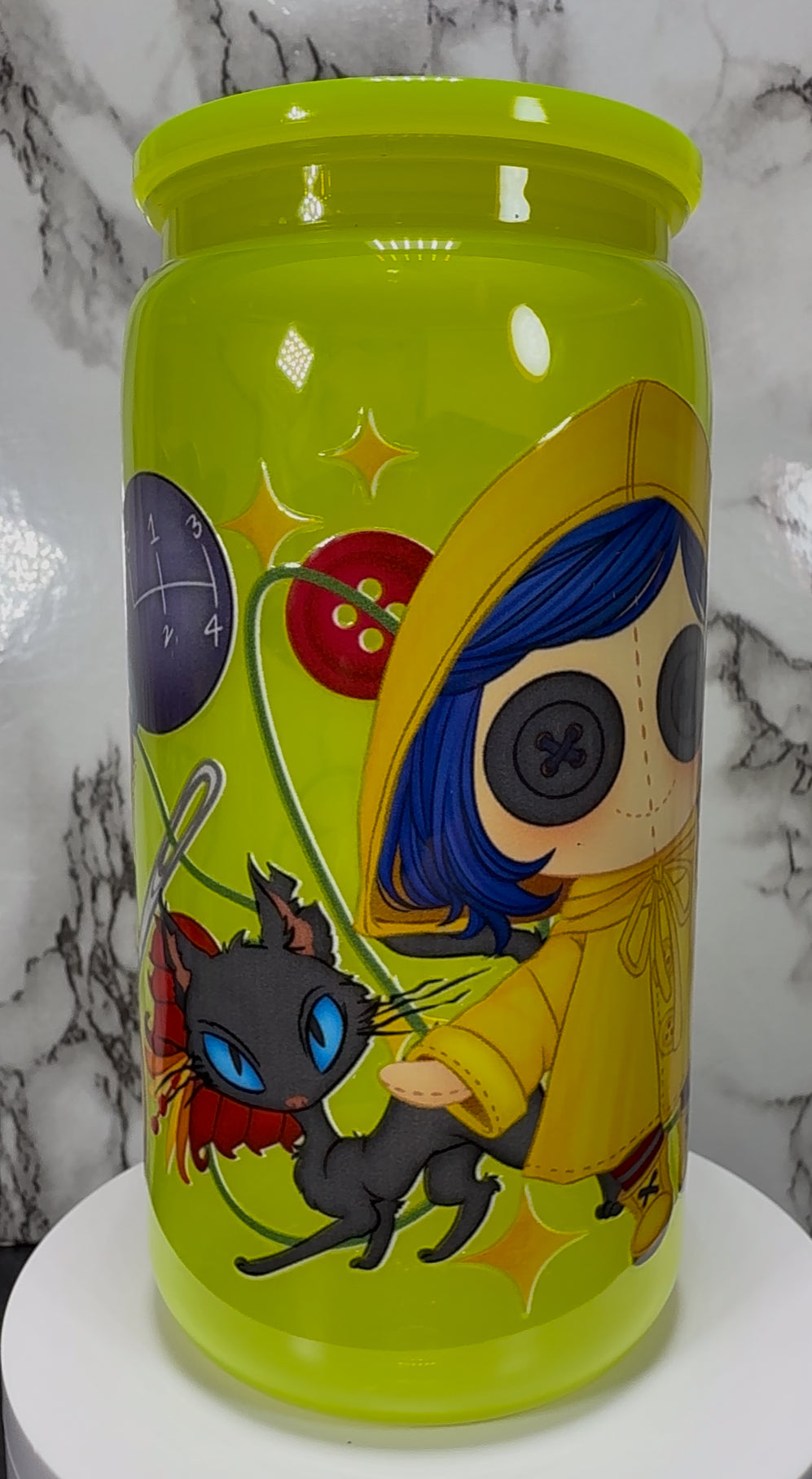 Little Coraline on a bright yellow PLASTIC beer can cup