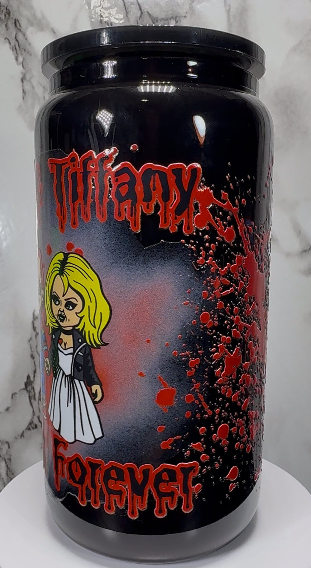 Chucky & Tiffany UVDTF on a black beer can glass