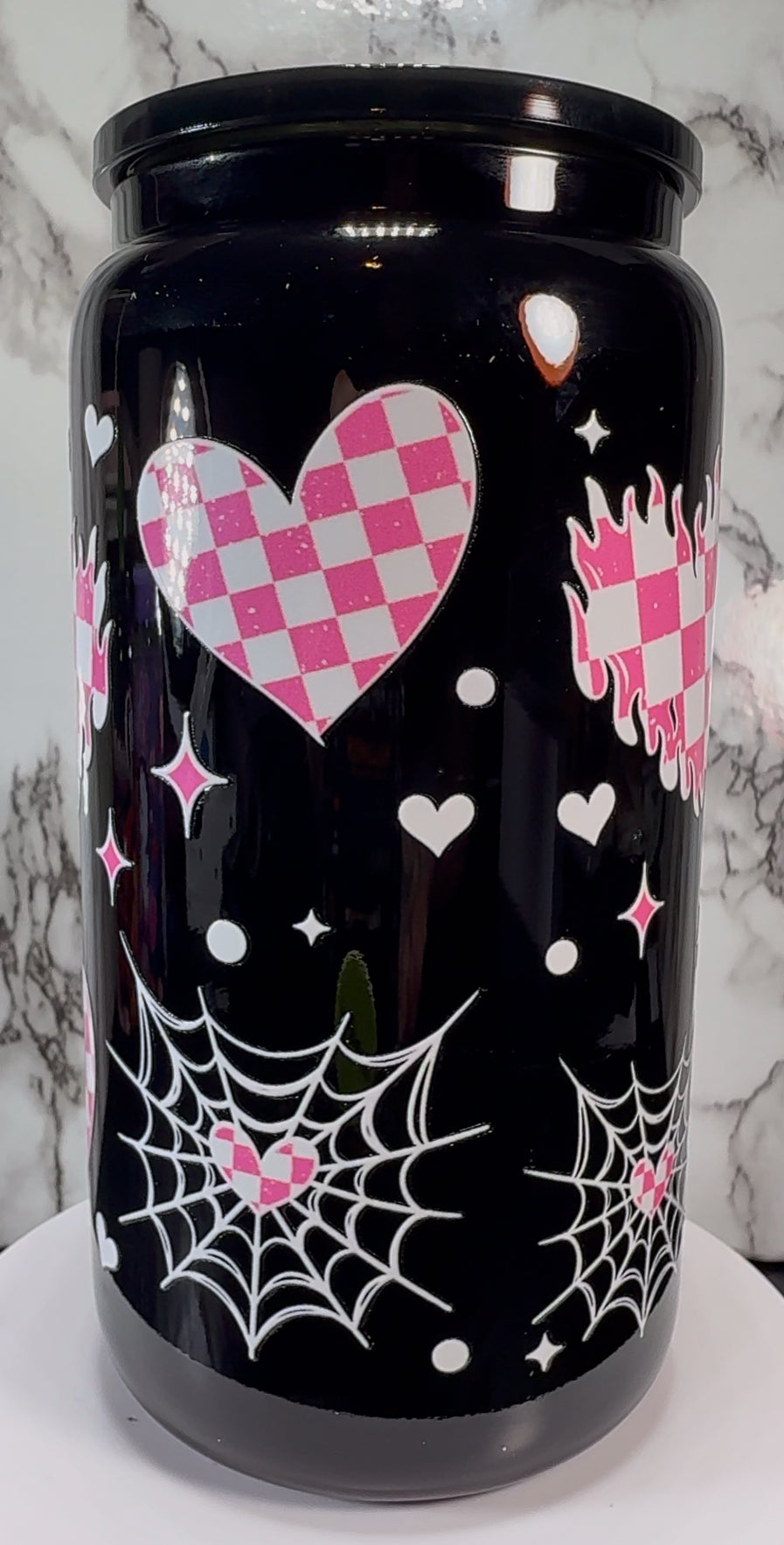 Pink & White checkered hearts UVDTF on a black beer can glass