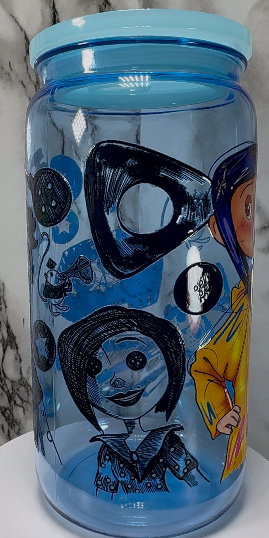 Coraline UVDTF on a blue PLASTIC beer can cup