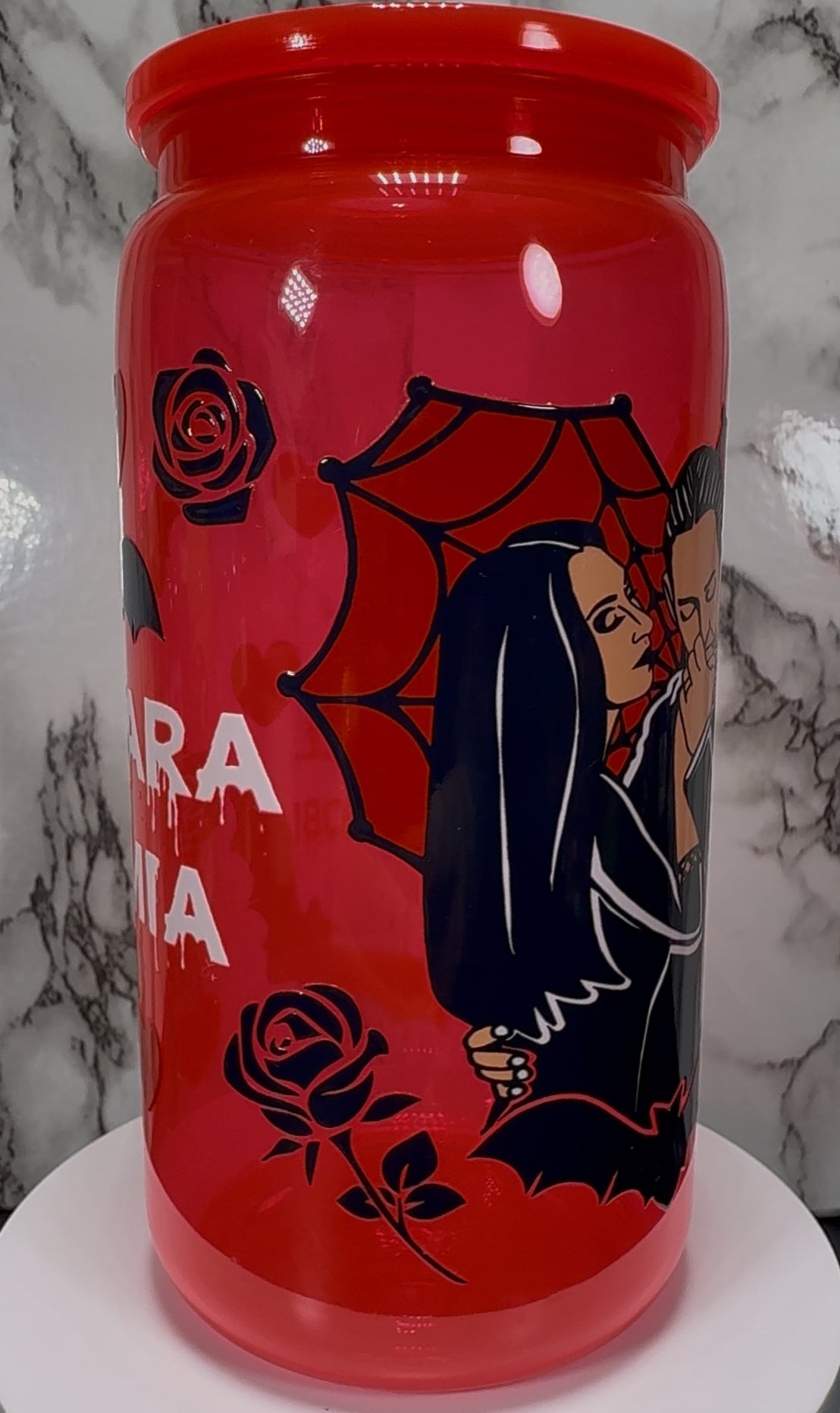 Gomez and Morticia Addams from Addams Family UVDTF on a bright red PLASTIC beer cancup