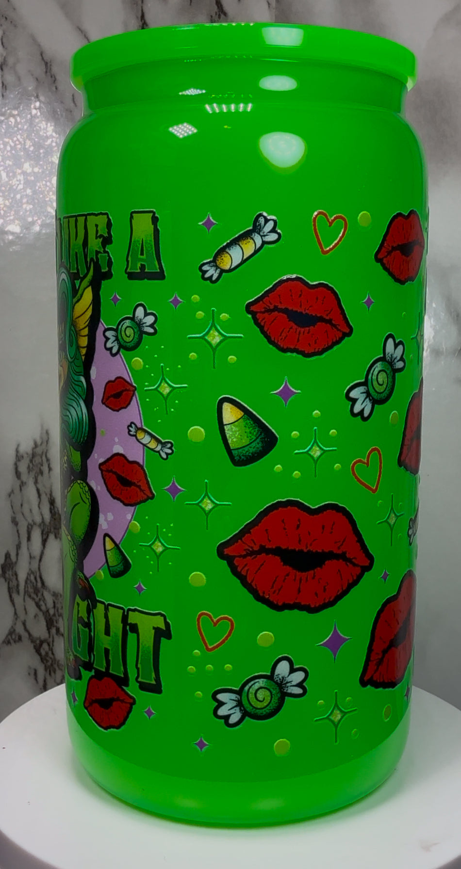 Greta Gremlin UVDTF in a bright green beer can glass