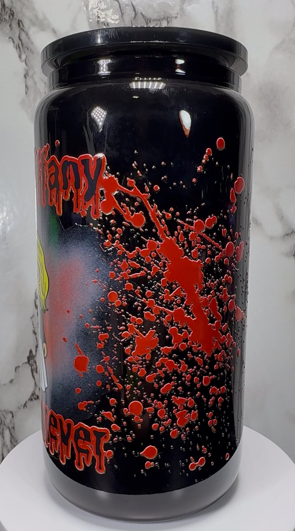 Chucky & Tiffany UVDTF on a black beer can glass