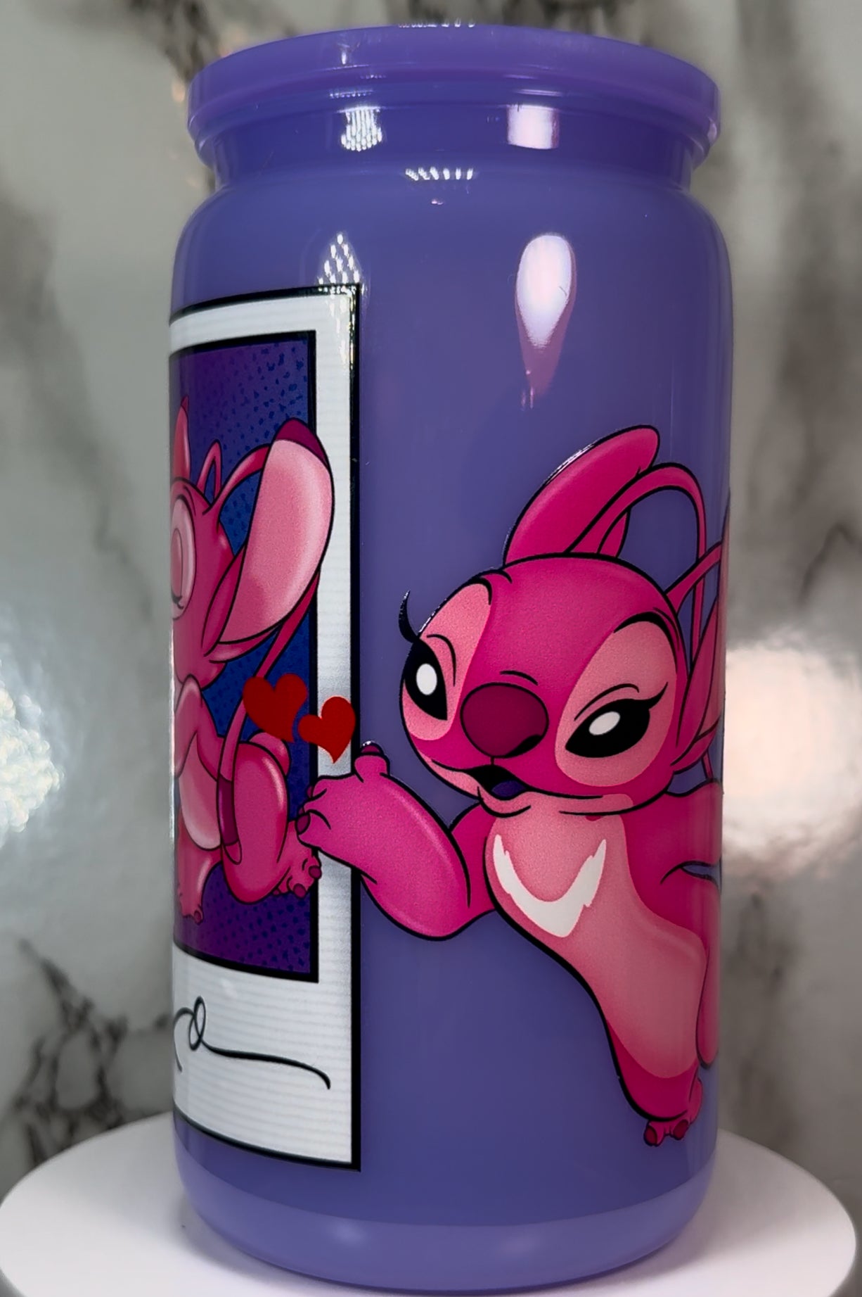 Stitch & Angel Polaroid UVDTF on a plastic purple beer can cup