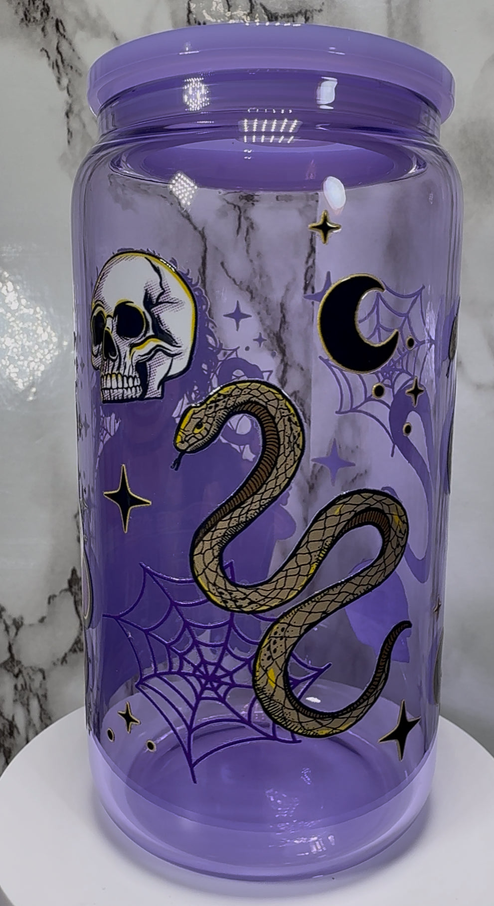 The Craft We Are The Weirdos UVDTF on a purple beer can glass