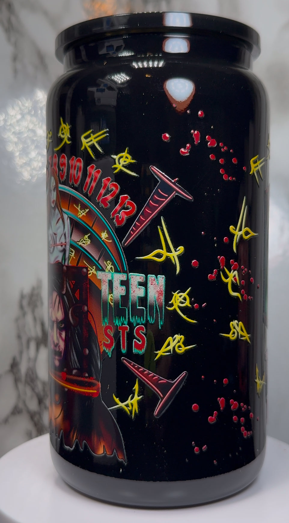 13 Ghosts Angry Princess UVDTF on a black beer can glass