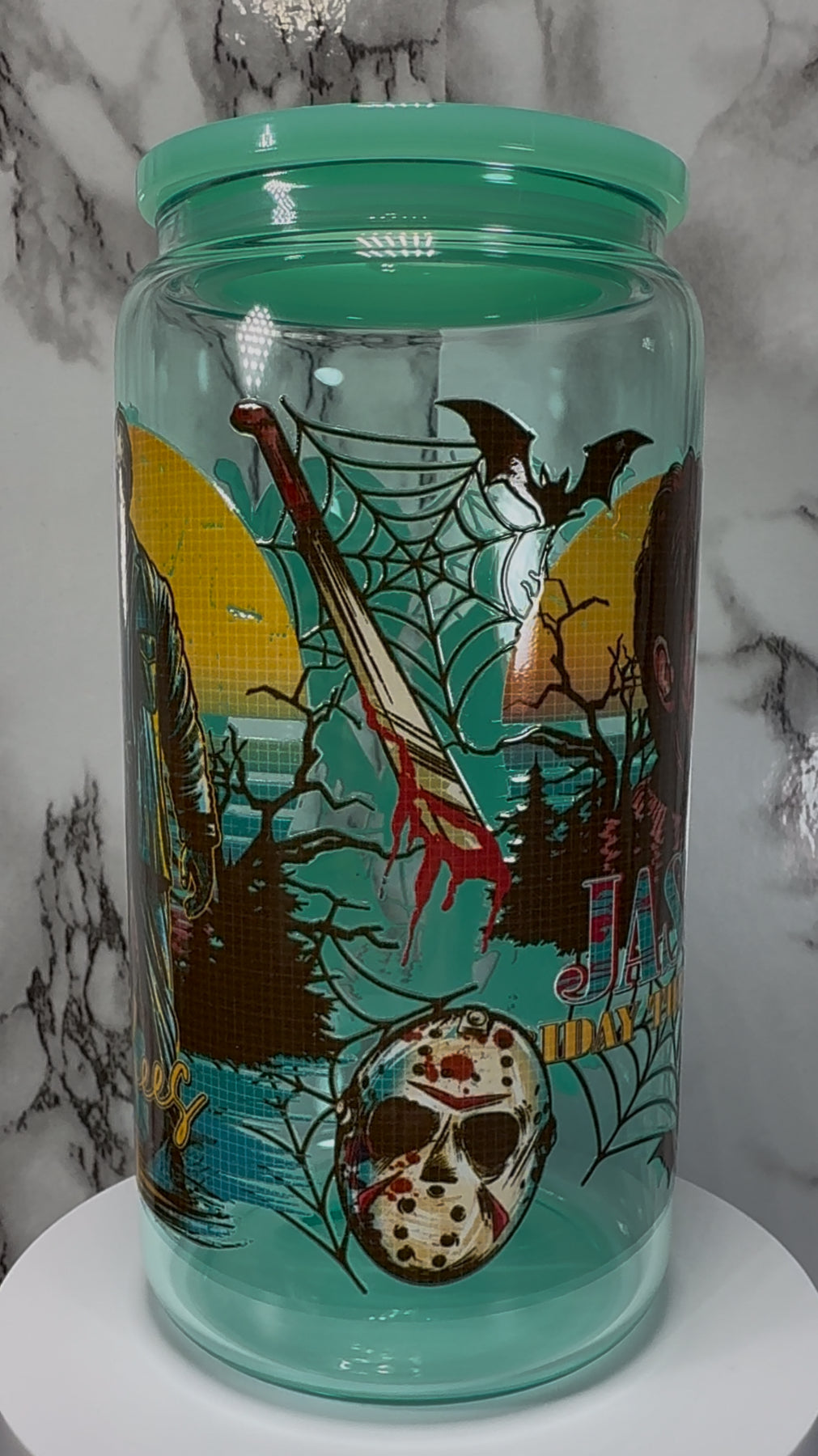 Friday the 13th Jason Voorhees UVDTF on a teal beer can glass