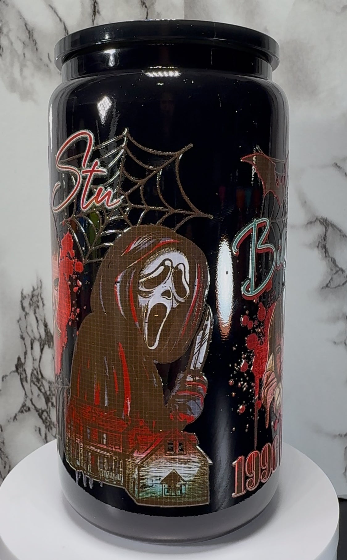 Scream Movie Ghostface UVDTF on a black beer can glass