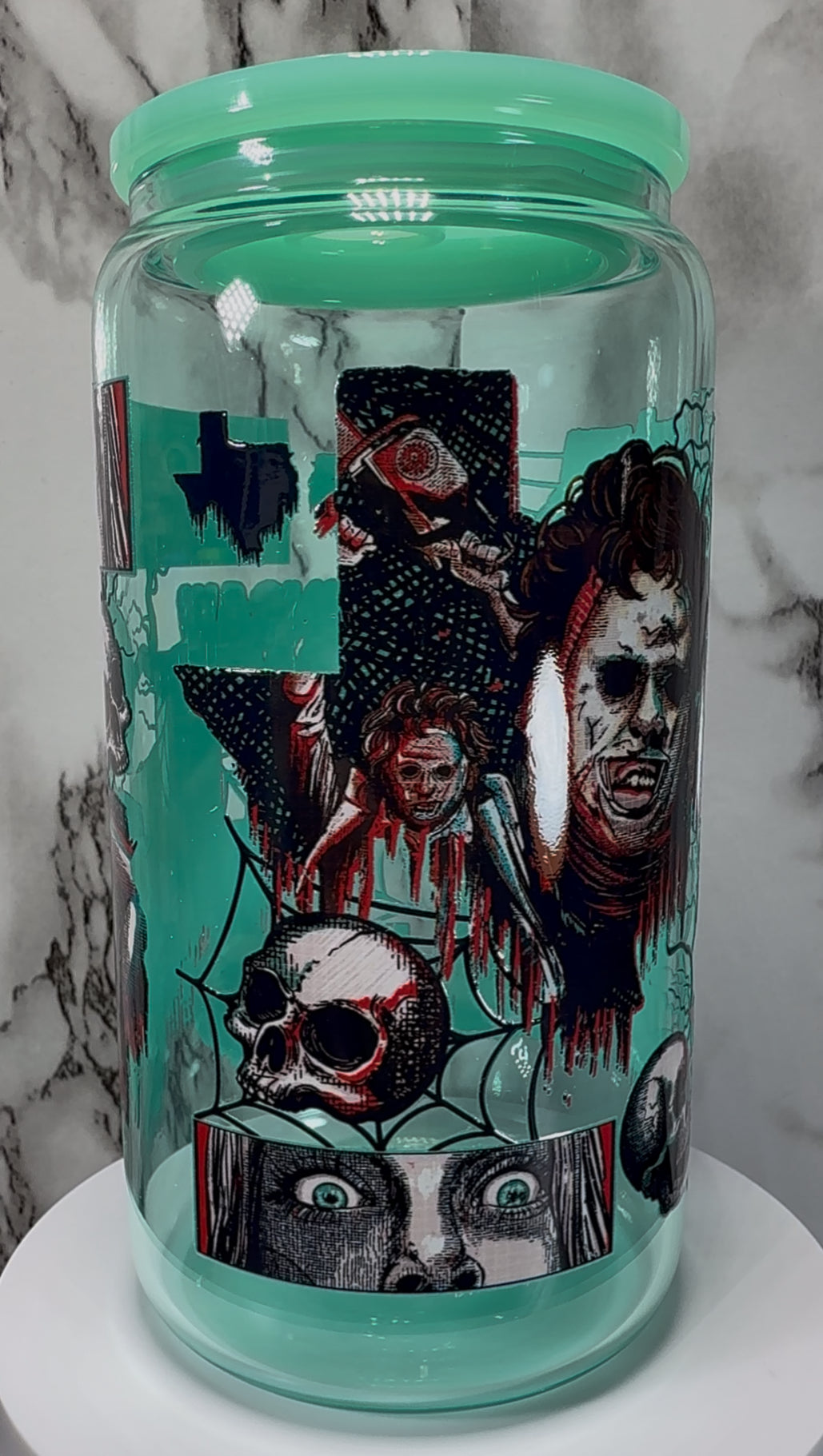 Texas Chainsaw Massacre Leatherface UVDTF on a teal beer can glass