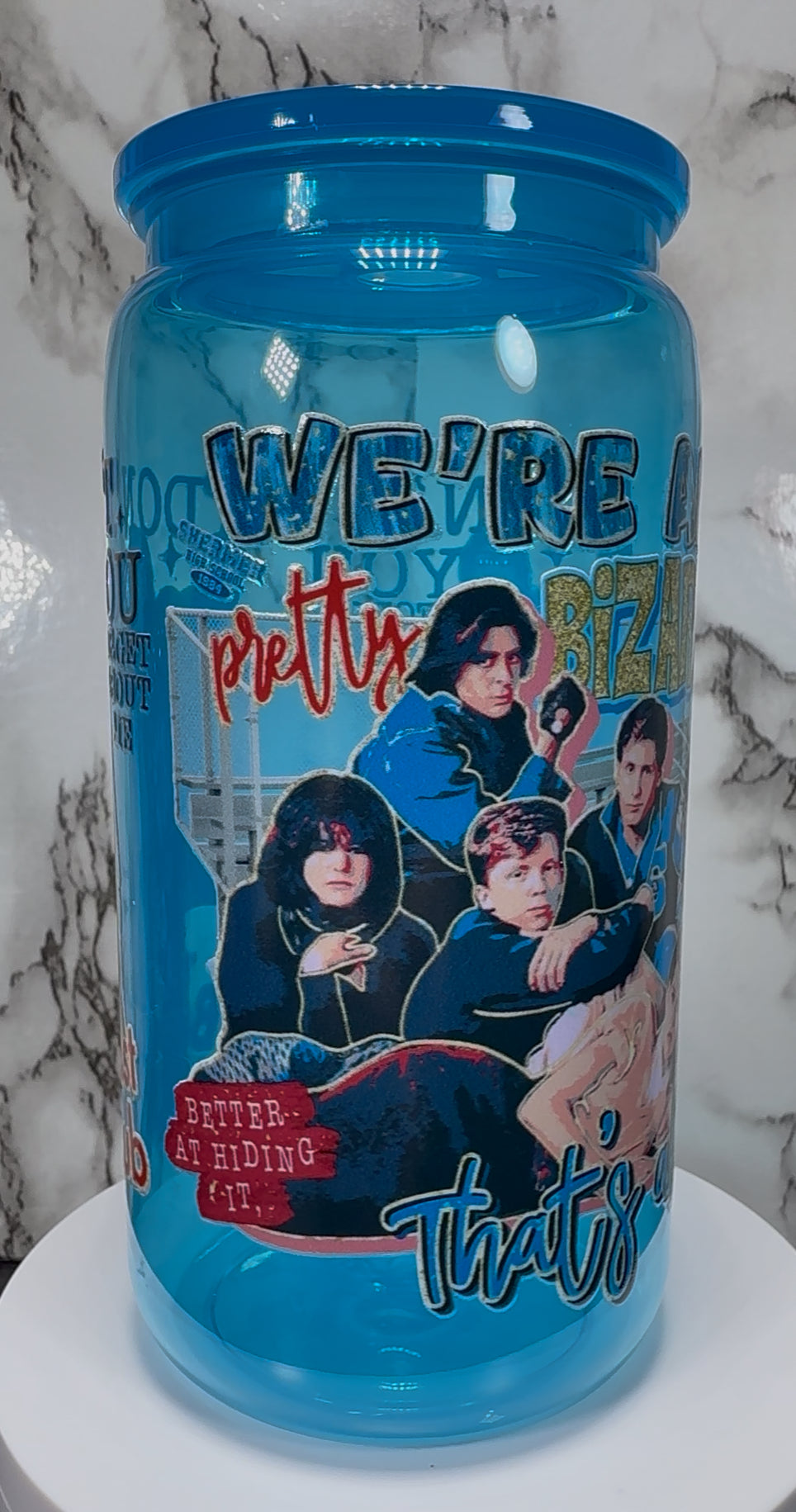 Breakfast Club UVDTF on a bright blue PLASTIC beer can cup
