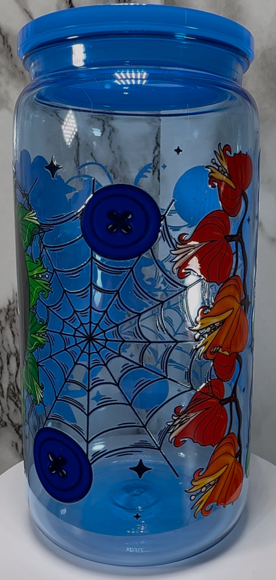 Coraline Other Mother UVDTF on a blue PLASTIC beer can cup