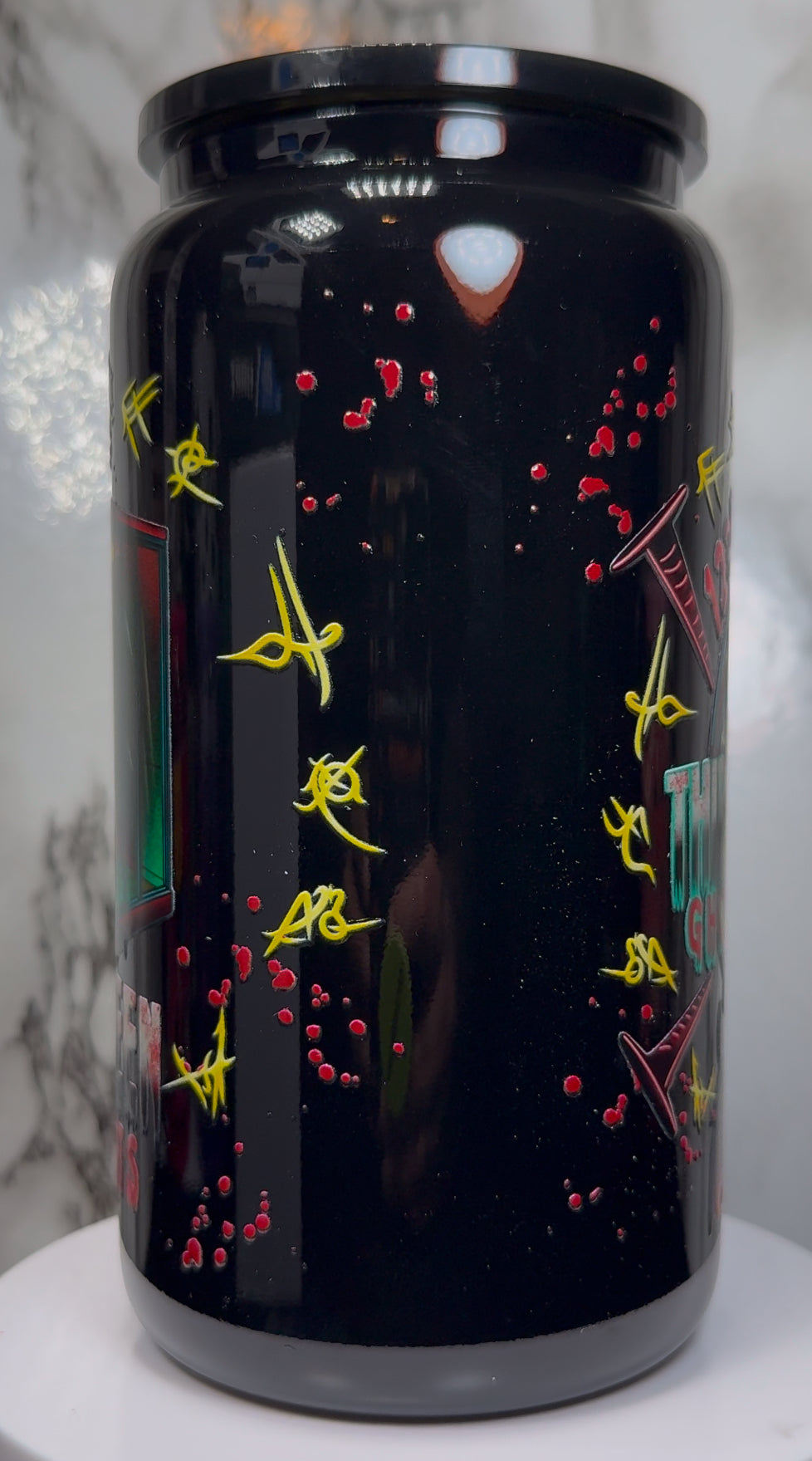 13 Ghosts Angry Princess UVDTF on a black beer can glass