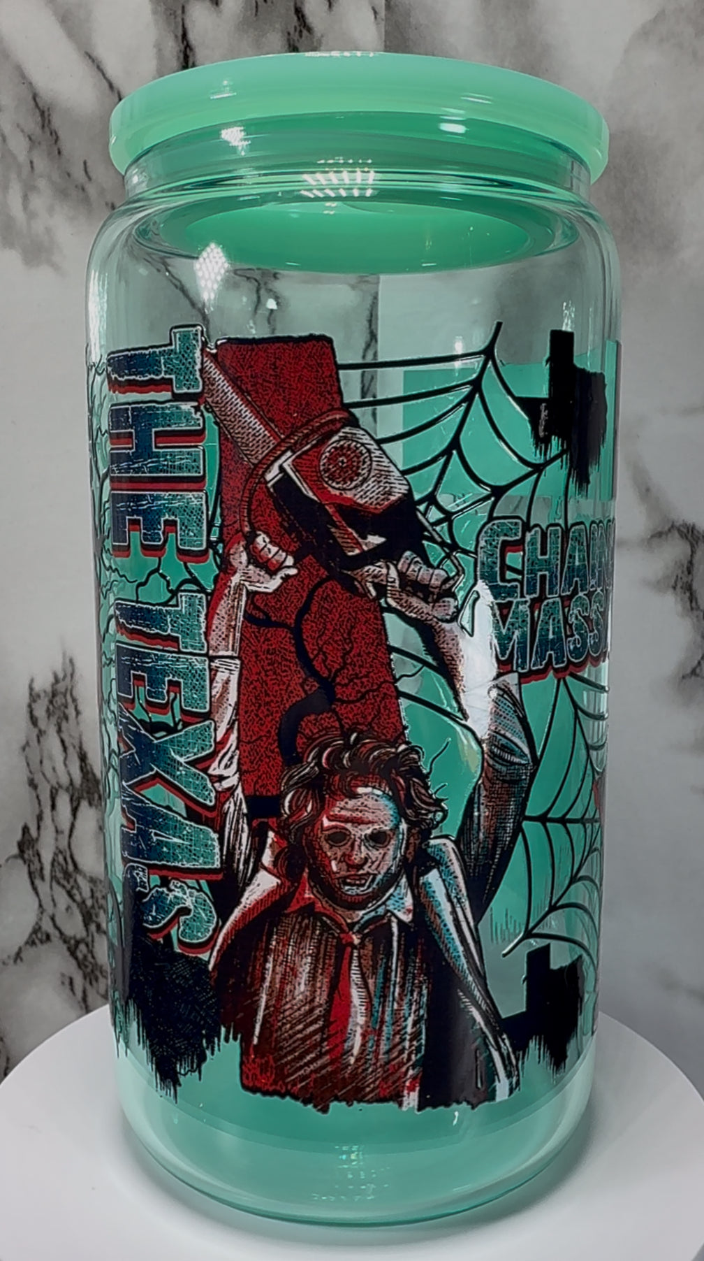 Texas Chainsaw Massacre Leatherface UVDTF on a teal beer can glass