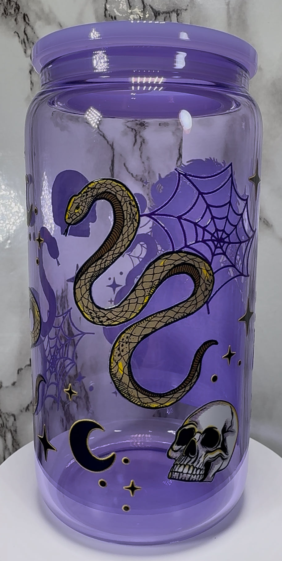 The Craft We Are The Weirdos UVDTF on a purple beer can glass