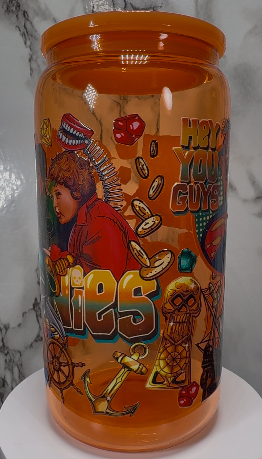 Goonies UVDTF on a orange beer can glass