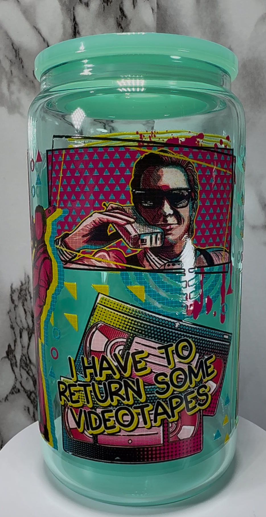 American Psycho Patrick Bateman UVDTF on a teal beer can glass