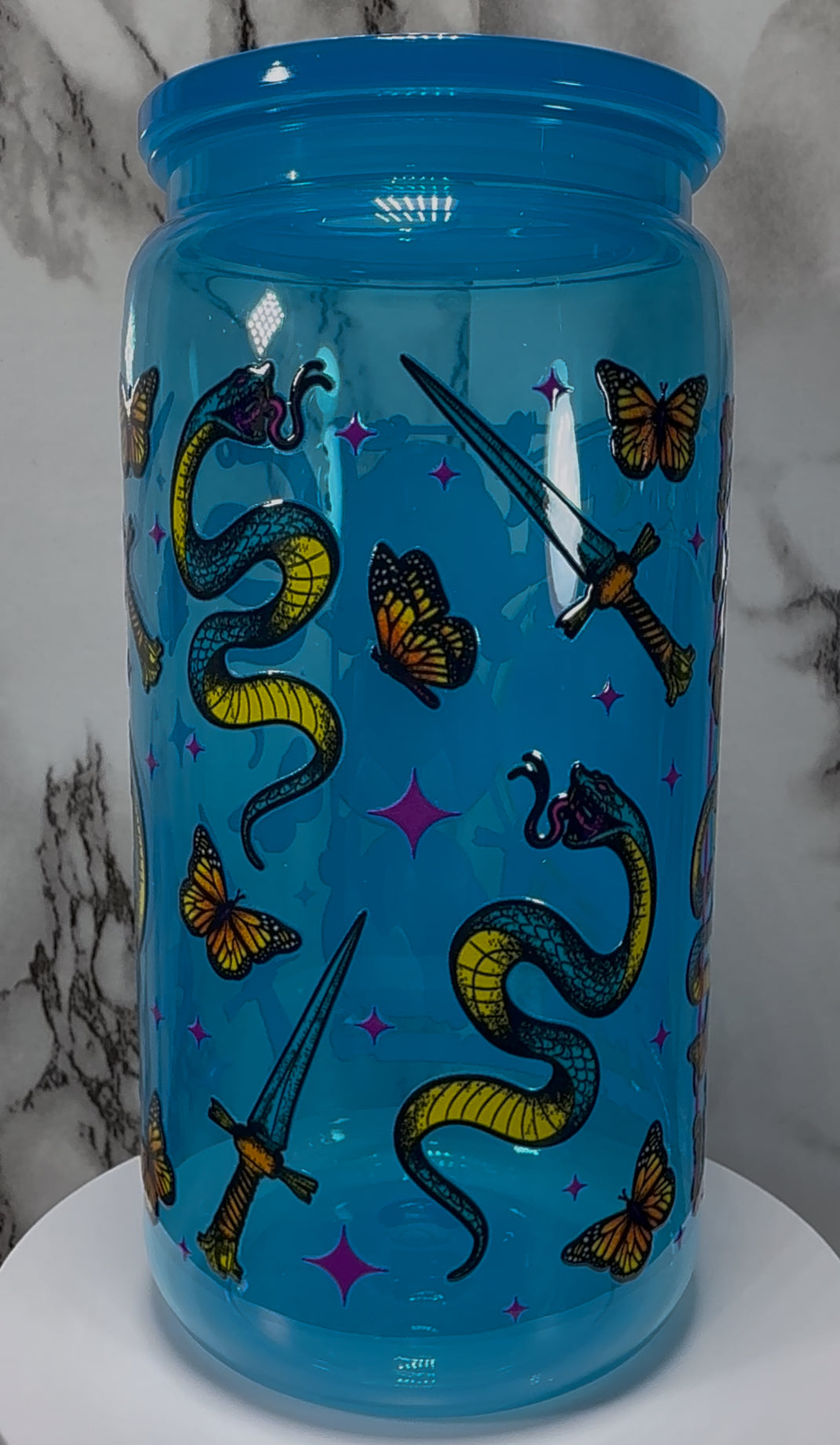 The Craft We Are The Weirdos Mister UVDTF on a bright blue PLASTIC beer can cup