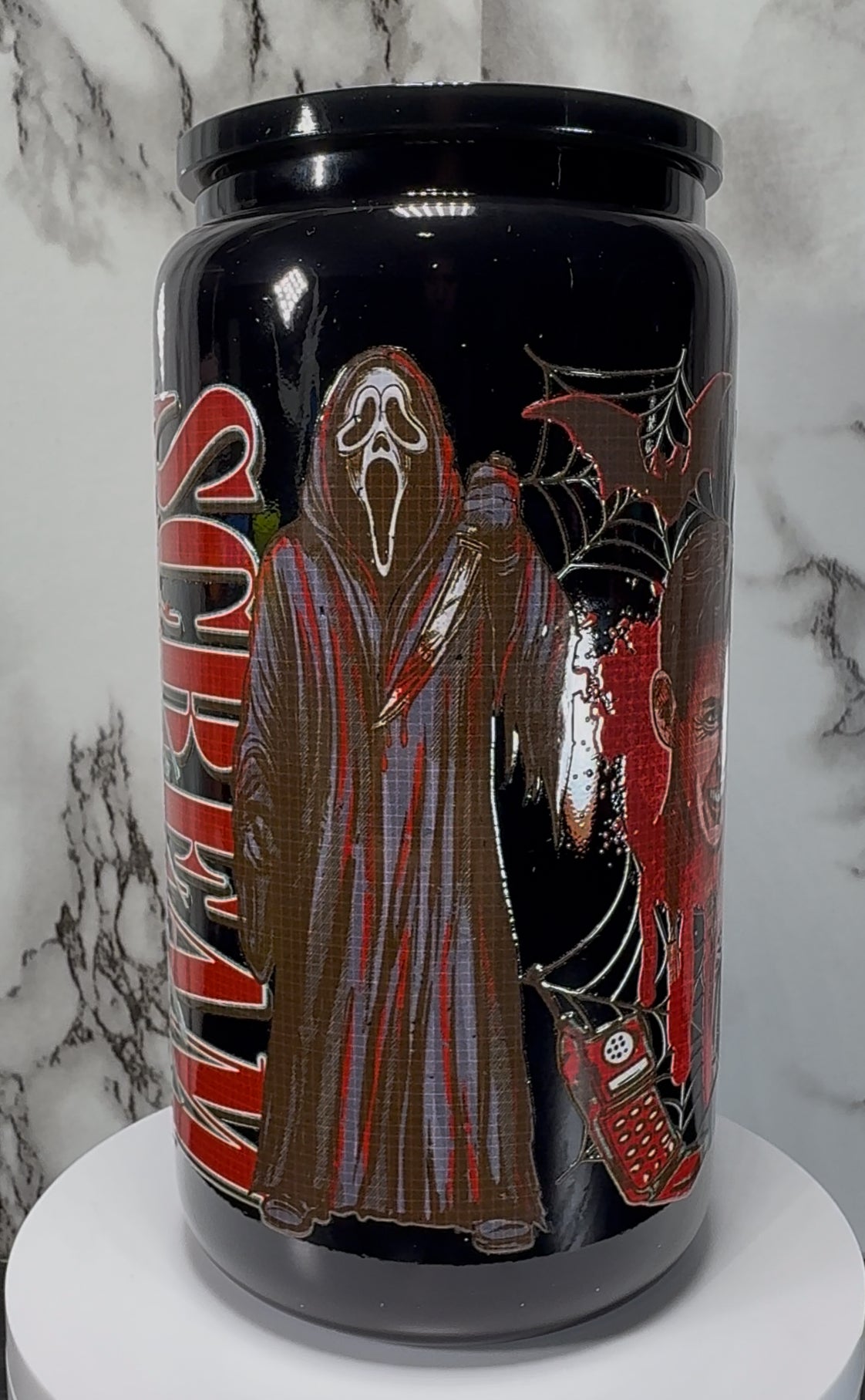 Scream Movie Ghostface UVDTF on a black beer can glass