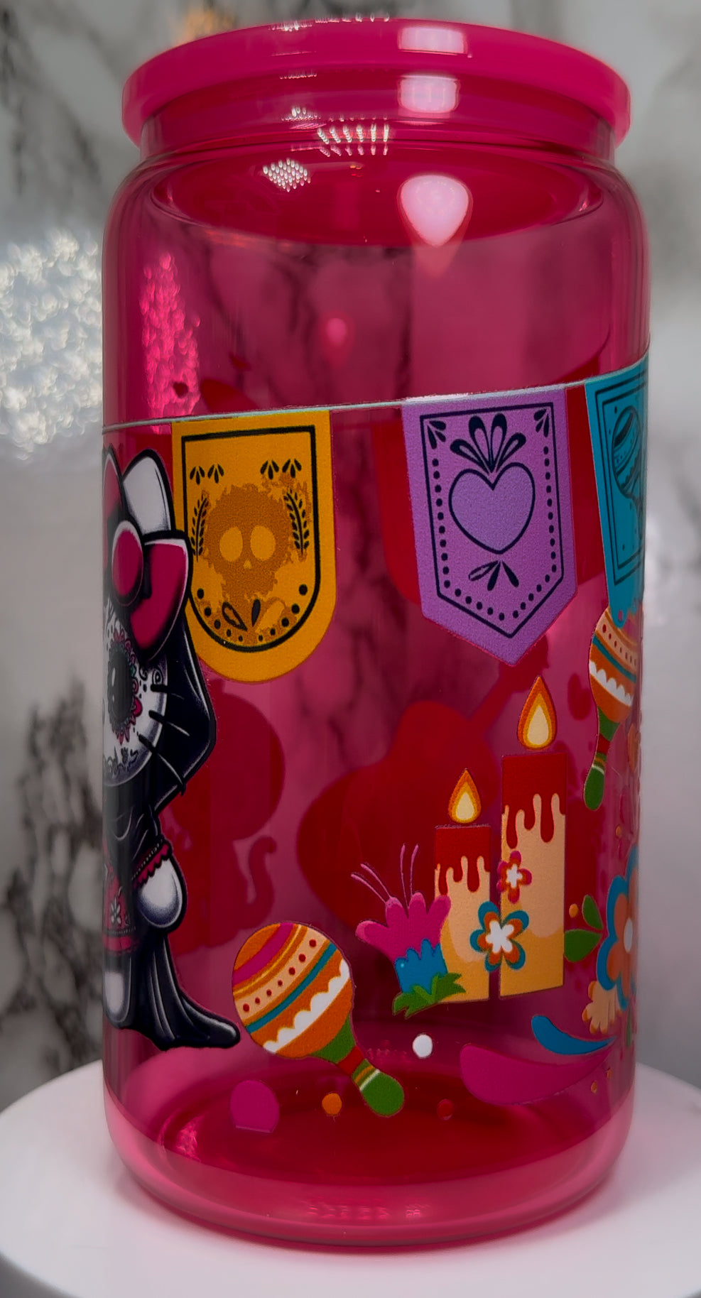 Dia De Los Muertos Hello Kitty UVDTF on a hot pink beer can glass