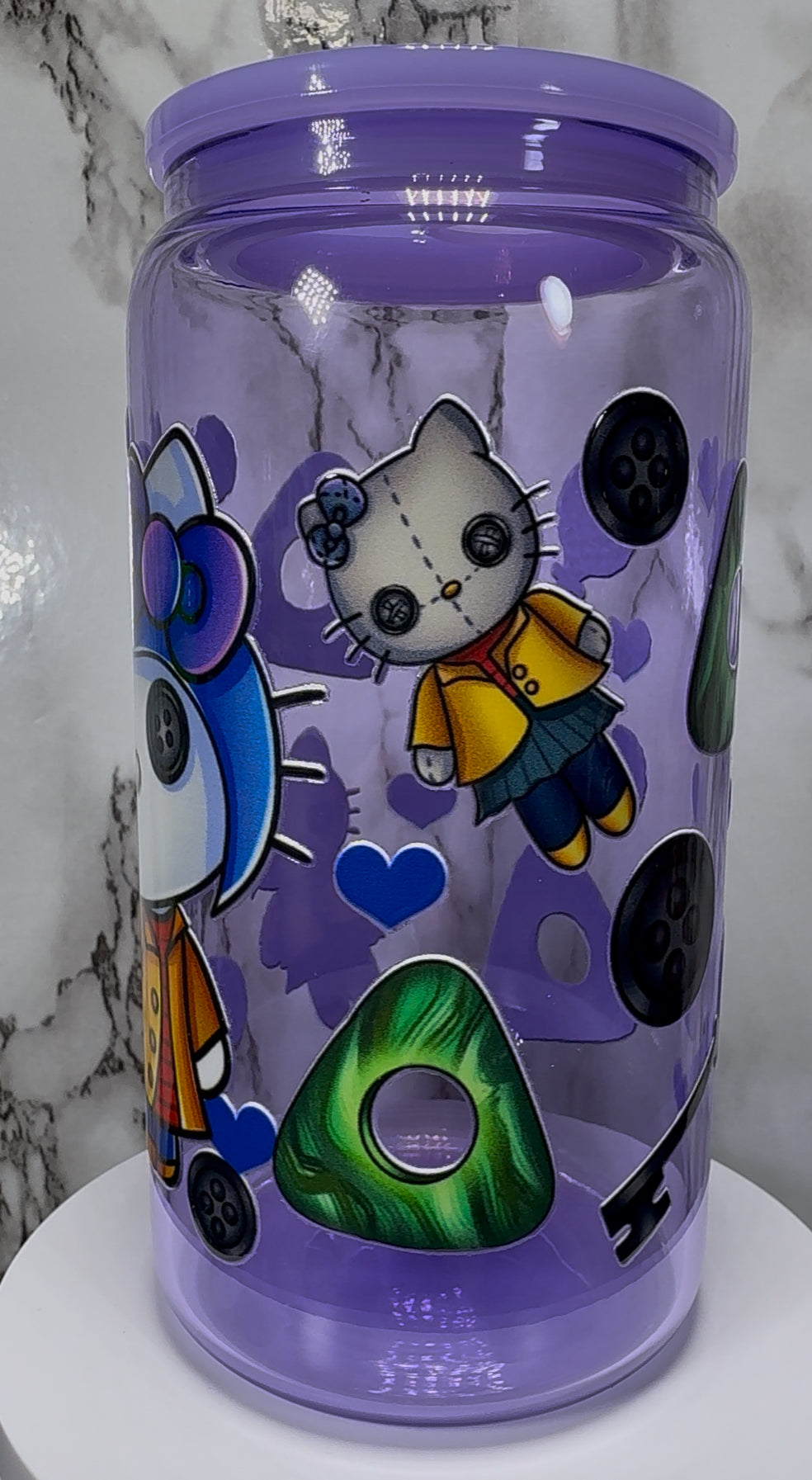 Coraline Hello Kitty UVDTF on a purple beer can glass