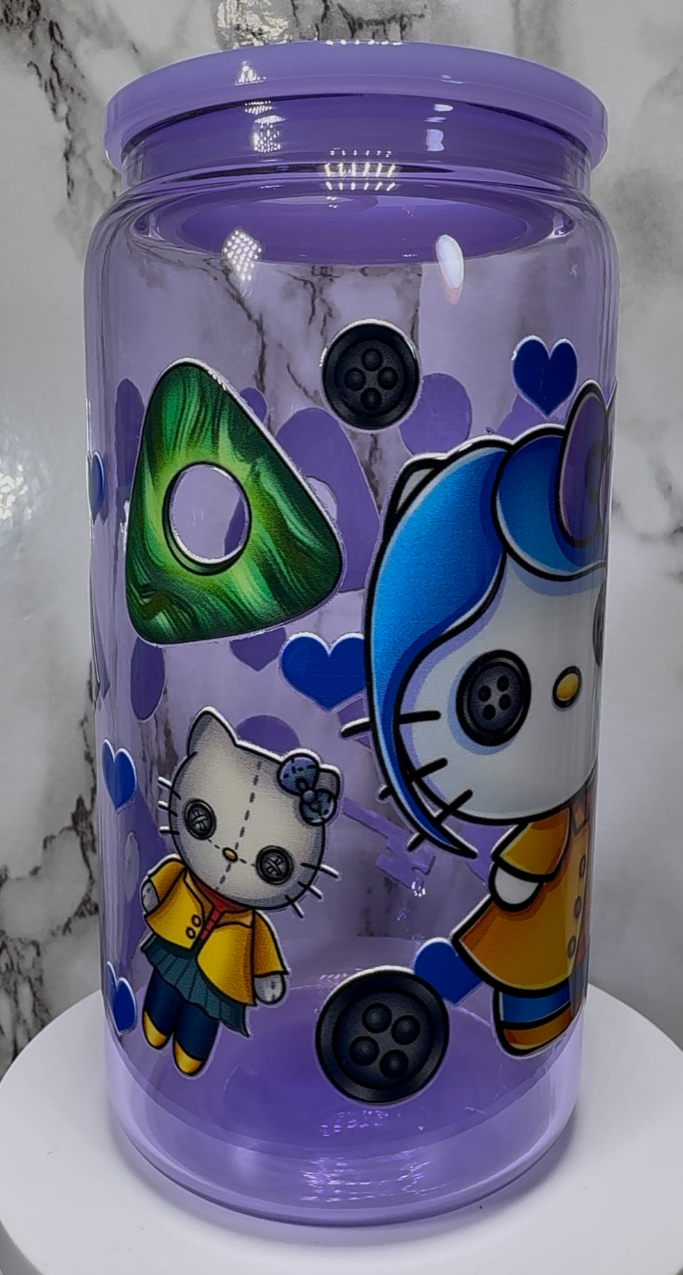 Coraline Hello Kitty UVDTF on a purple beer can glass