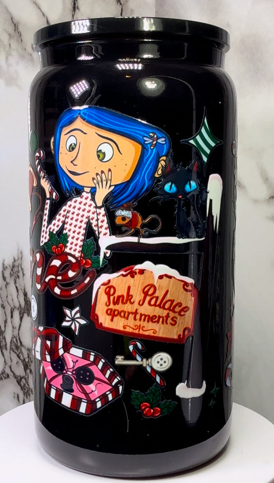 Coraline Christmas UVDTF on either a black plastic or black glass beer can cup