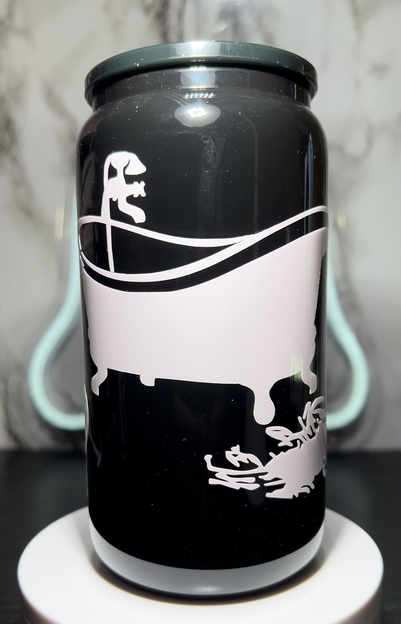 Saltburn color changing permanent vinyl on a all black beer can glass