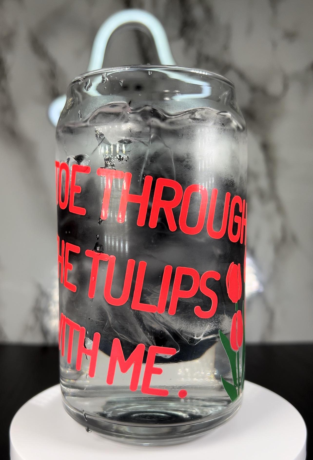 insidious Demon Tiptoe through the tulips with me color changing permanent vinyl on a libbey beer can glass.