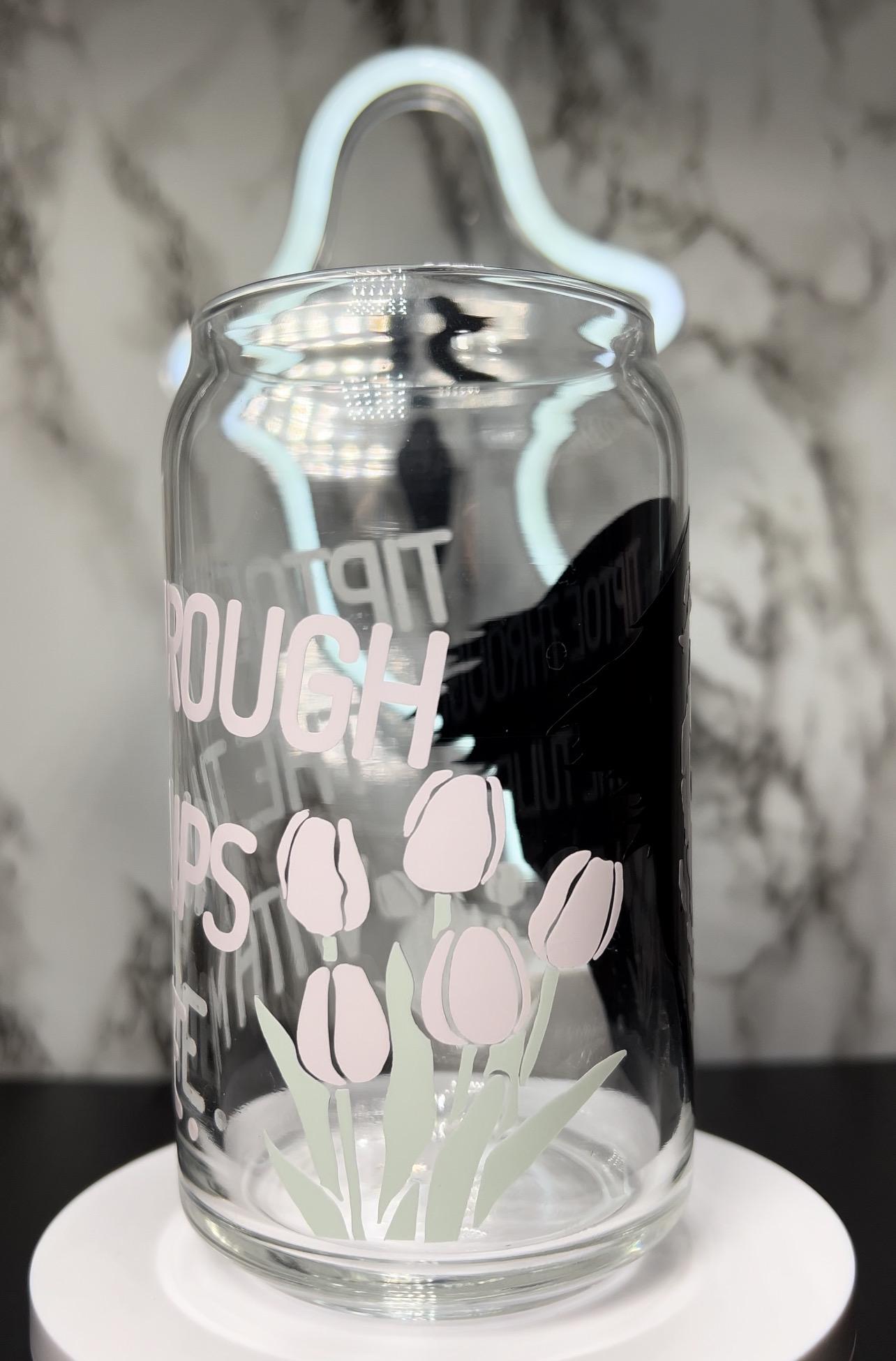 insidious Demon Tiptoe through the tulips with me color changing permanent vinyl on a libbey beer can glass.