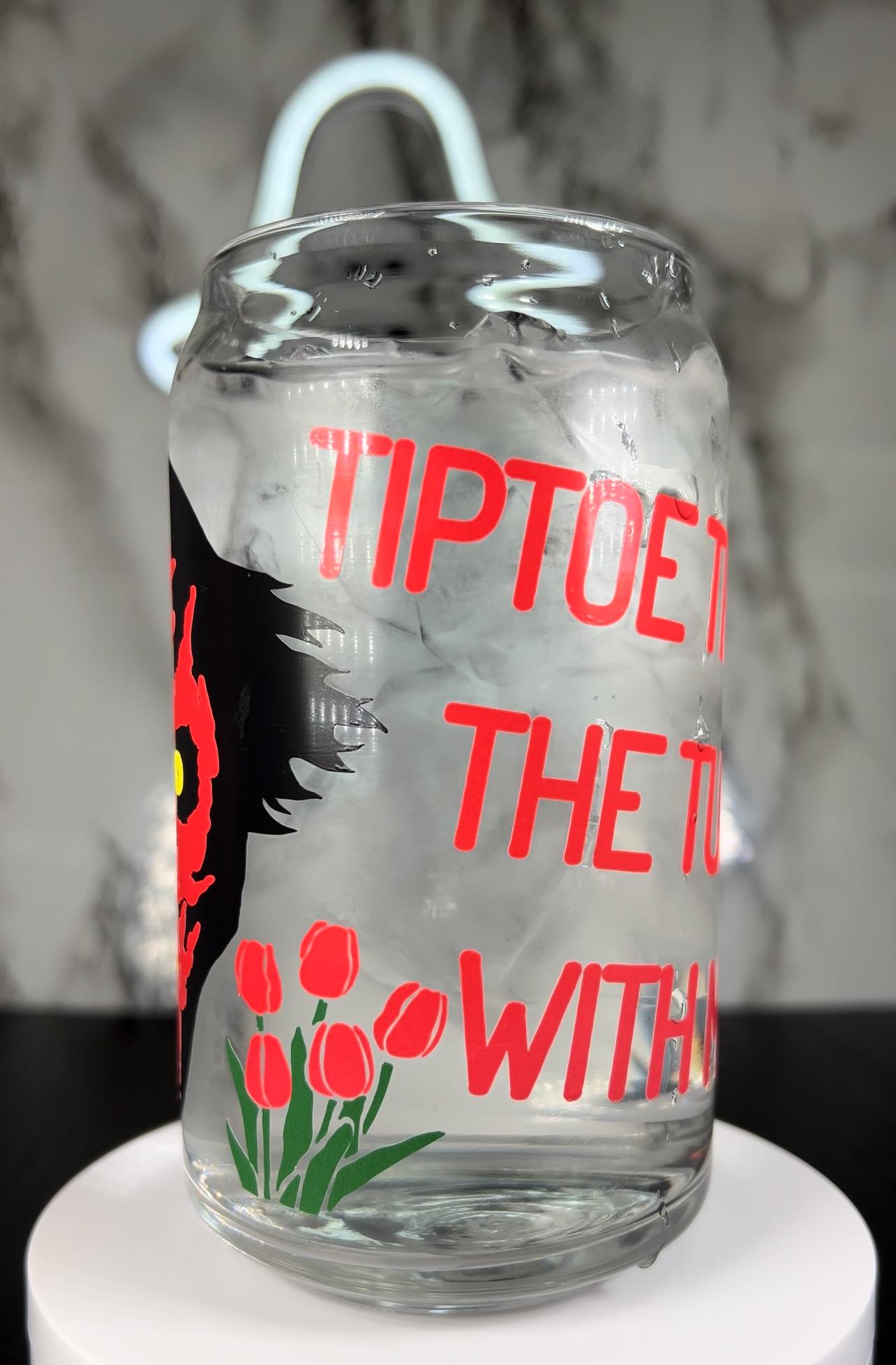 insidious Demon Tiptoe through the tulips with me color changing permanent vinyl on a libbey beer can glass.