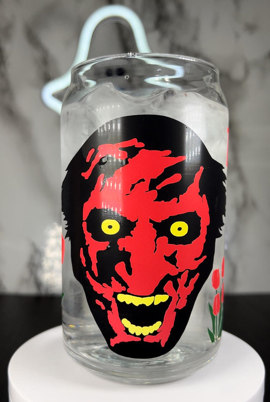 insidious Demon Tiptoe through the tulips with me color changing permanent vinyl on a libbey beer can glass.